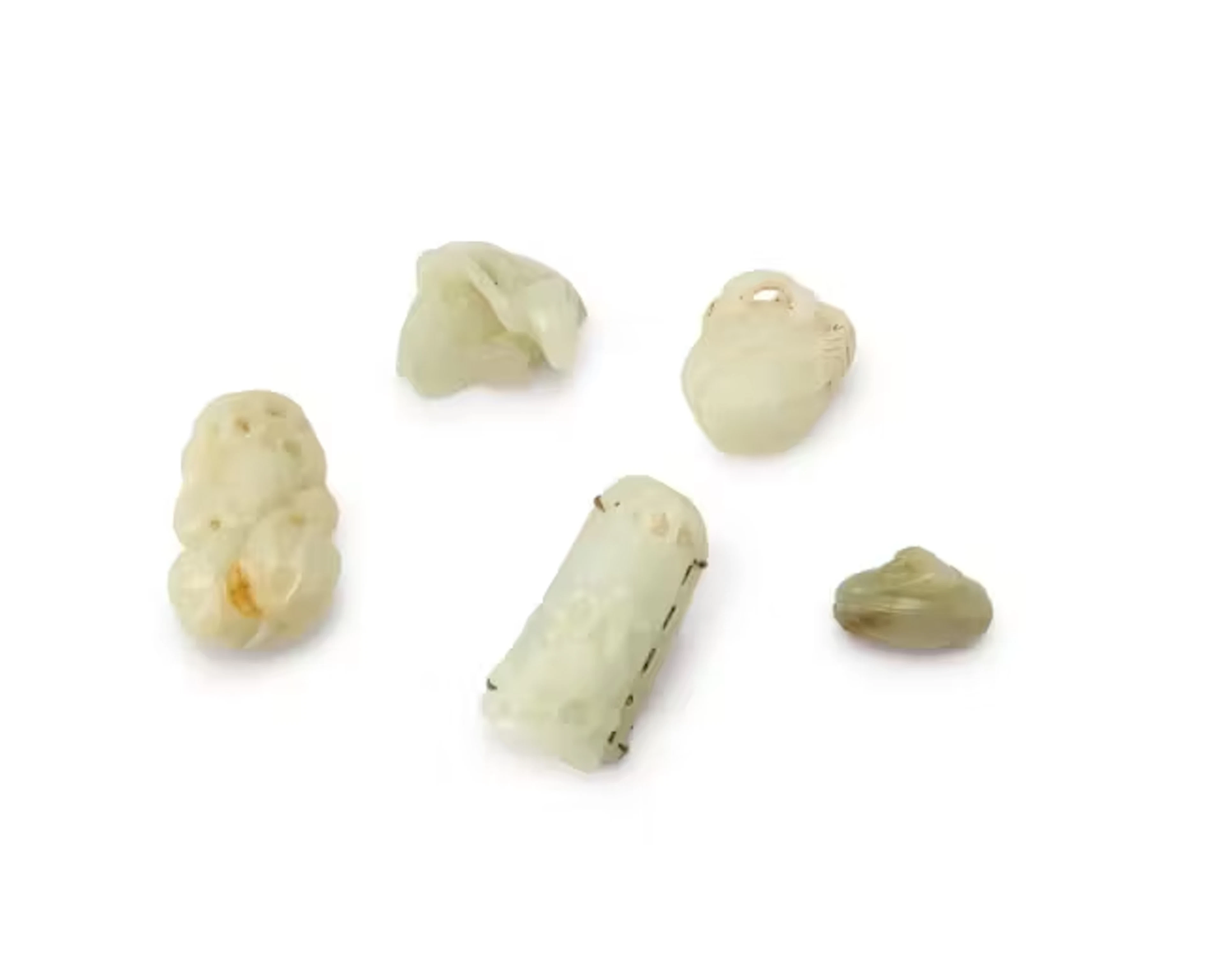 Five Chinese pale green jade carvings Qing dynasty One...