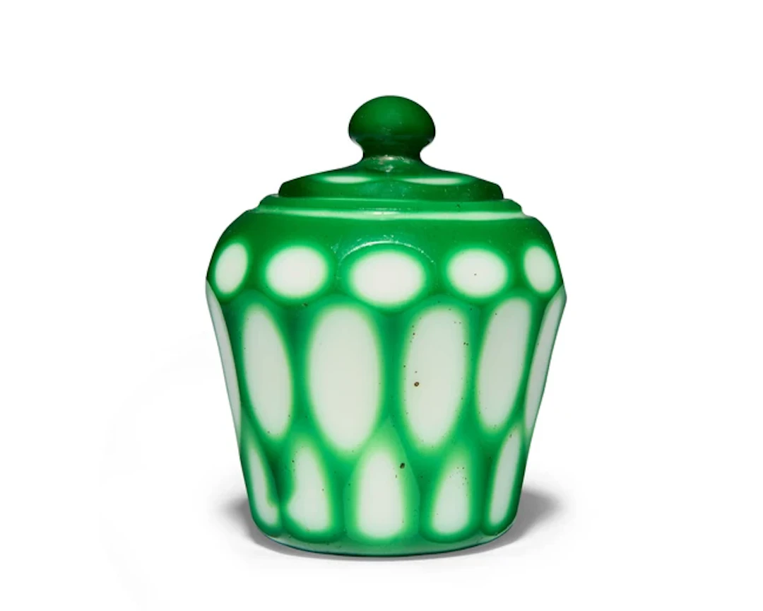 A Chinese green-overlay white glass faceted miniature jar and cover Qing dynasty