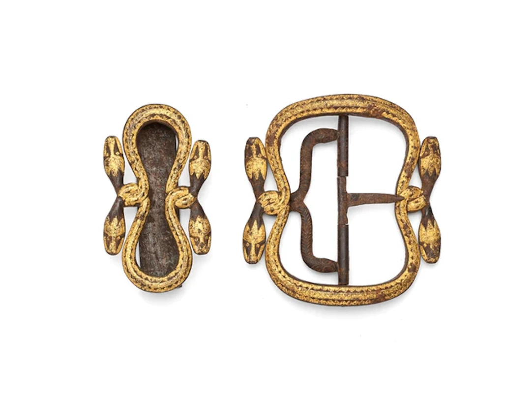 A Javanese parcel gilt iron belt buckle and attachment...