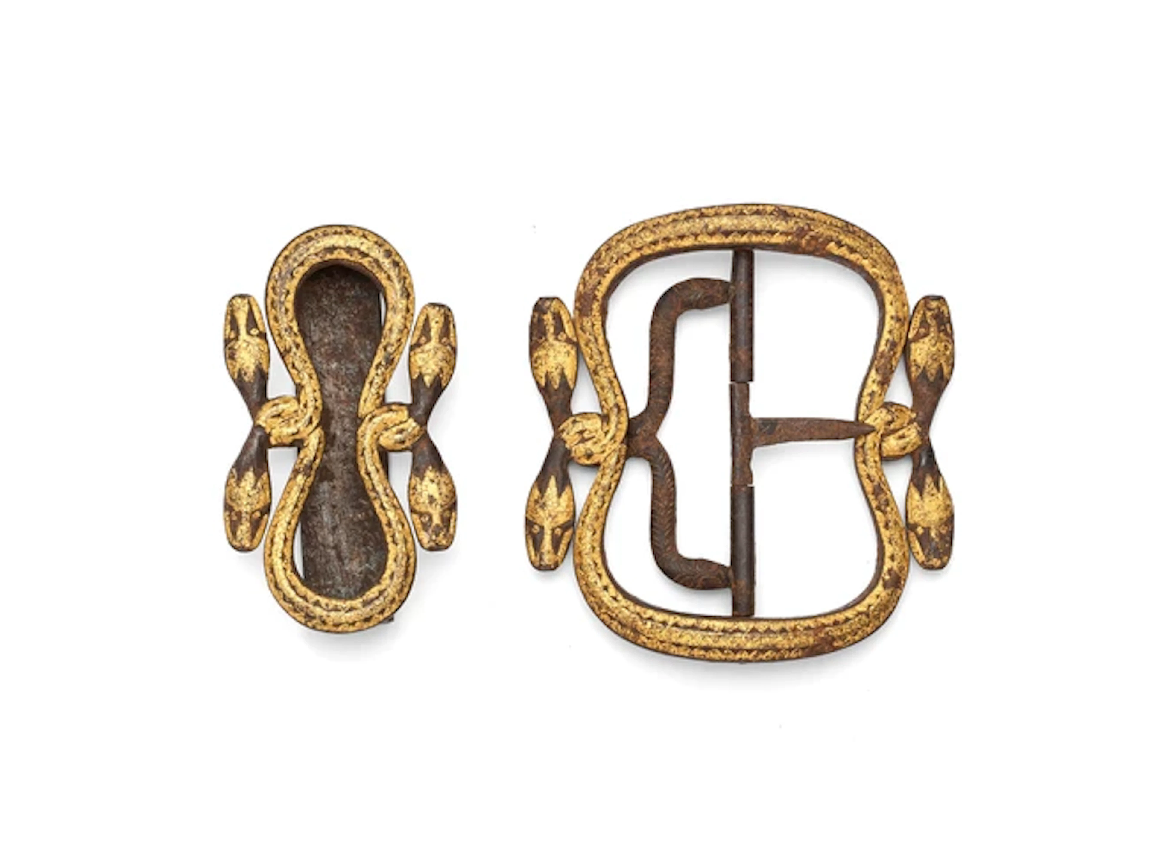 A Javanese parcel gilt iron belt buckle and attachment...