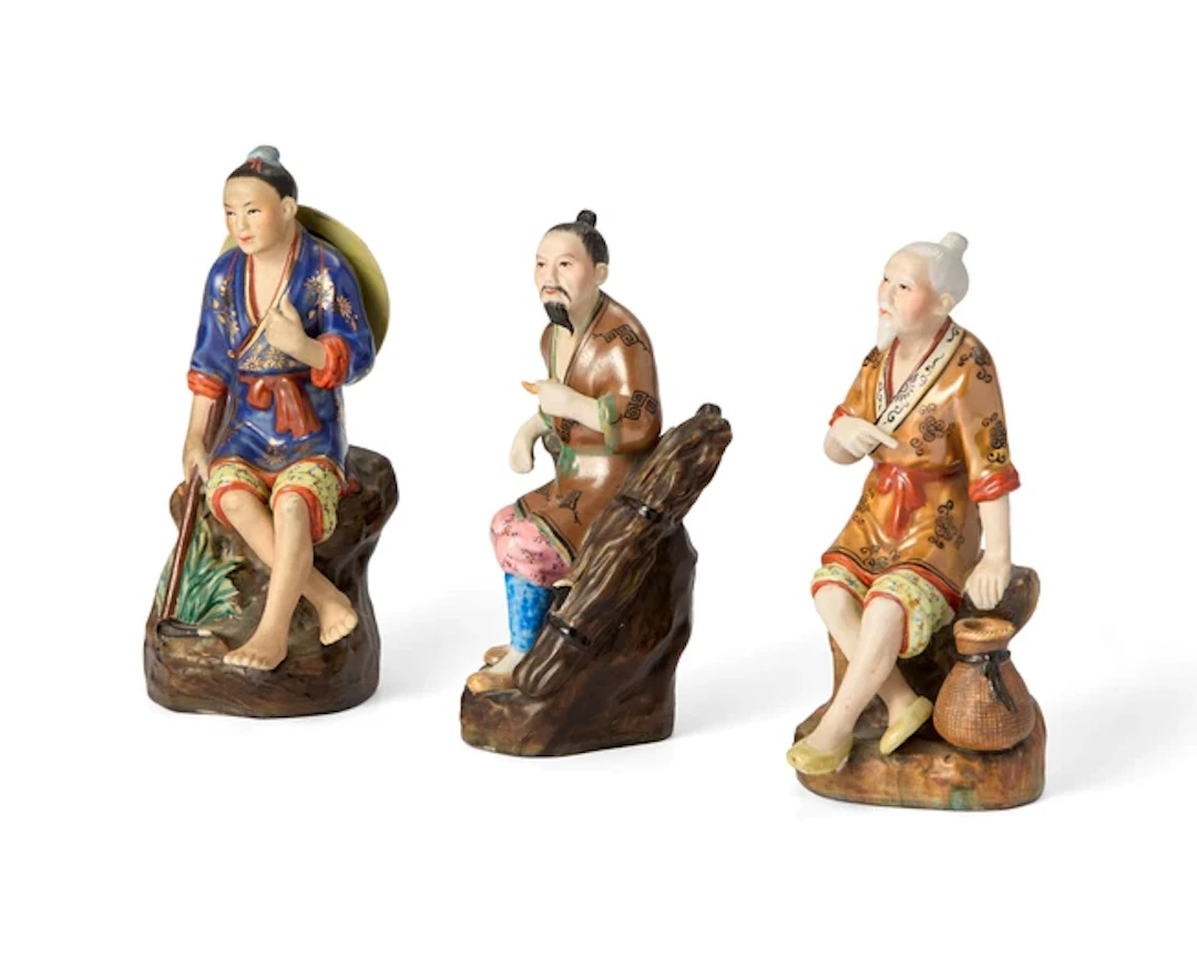 Three Chinese famille rose and enamelled figures of...