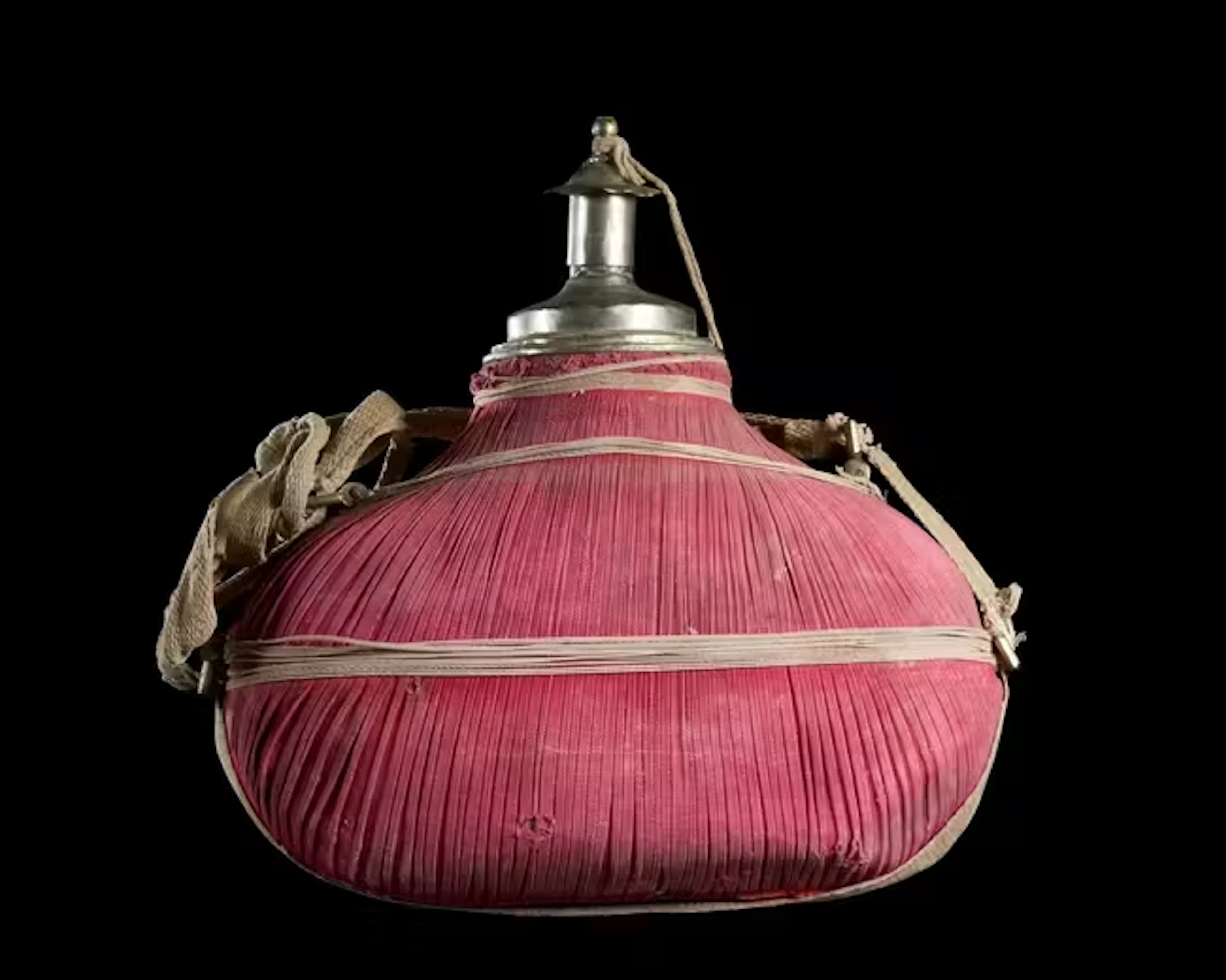 A red cotton-covered pilgrim flask (matara)
