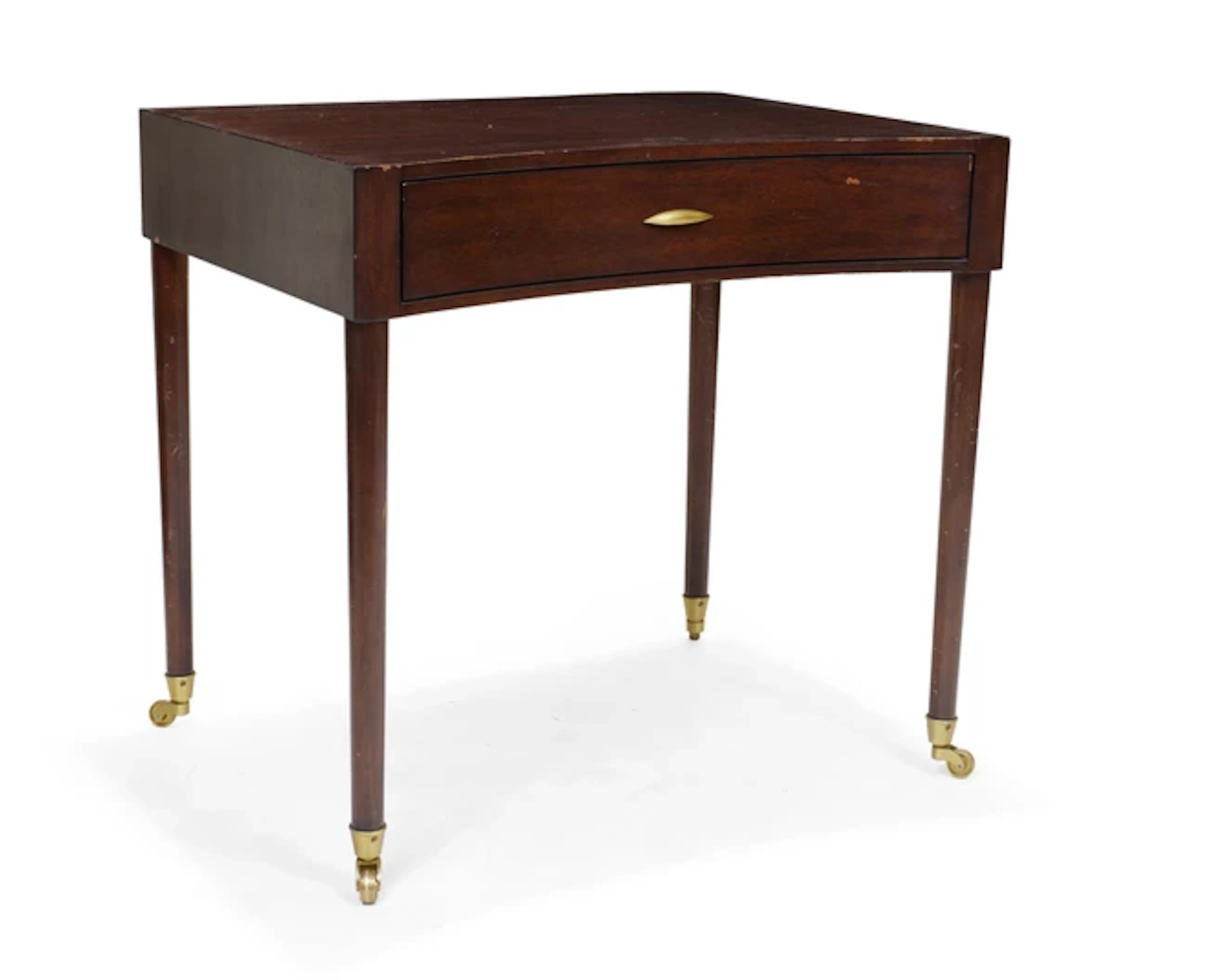 A modern mahogany concave front writing table