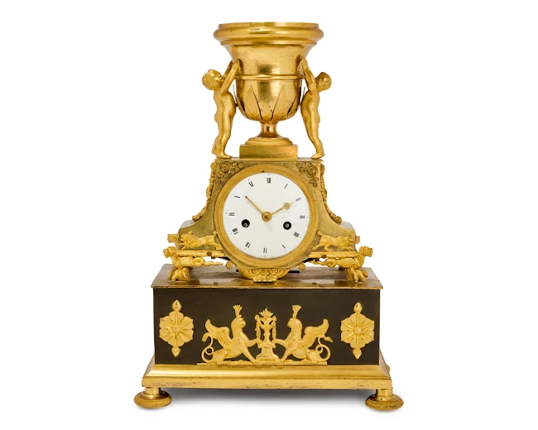 An Empire gilt and patinated bronze clock