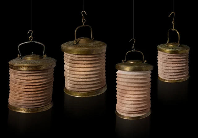 Three brass and linen hanging lanterns