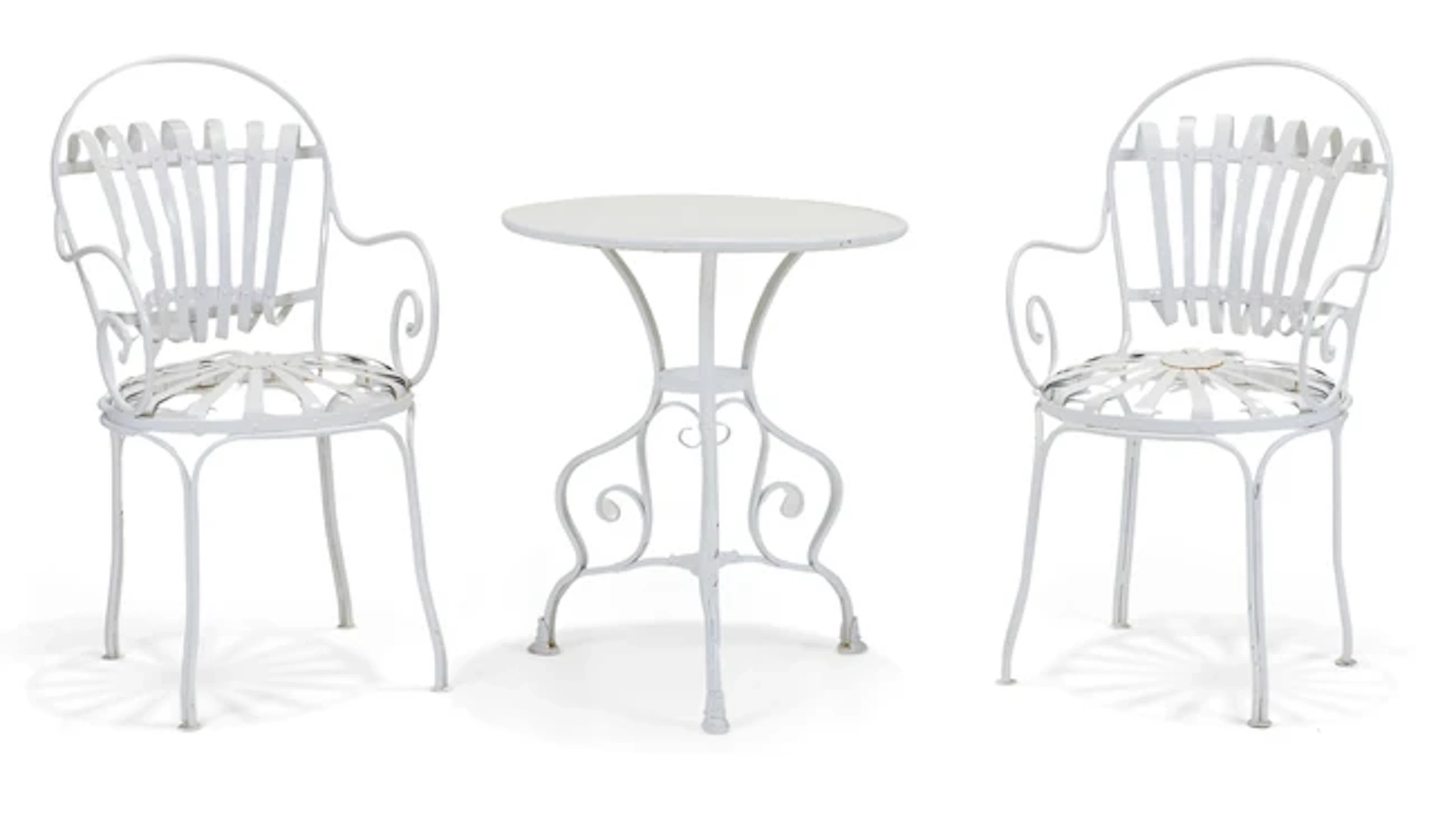 A pair of modern white-painted iron sprung bistro chairs