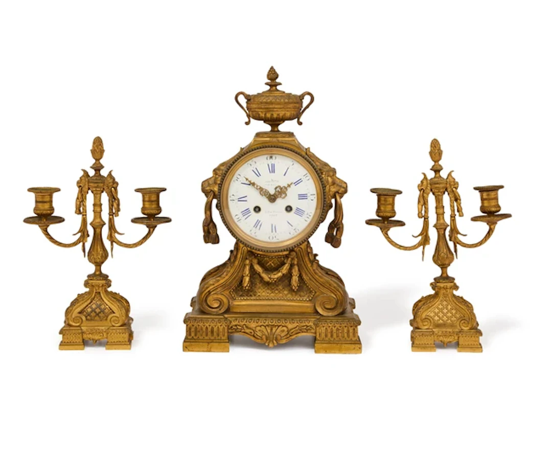 A French gilt-bronze clock garniture