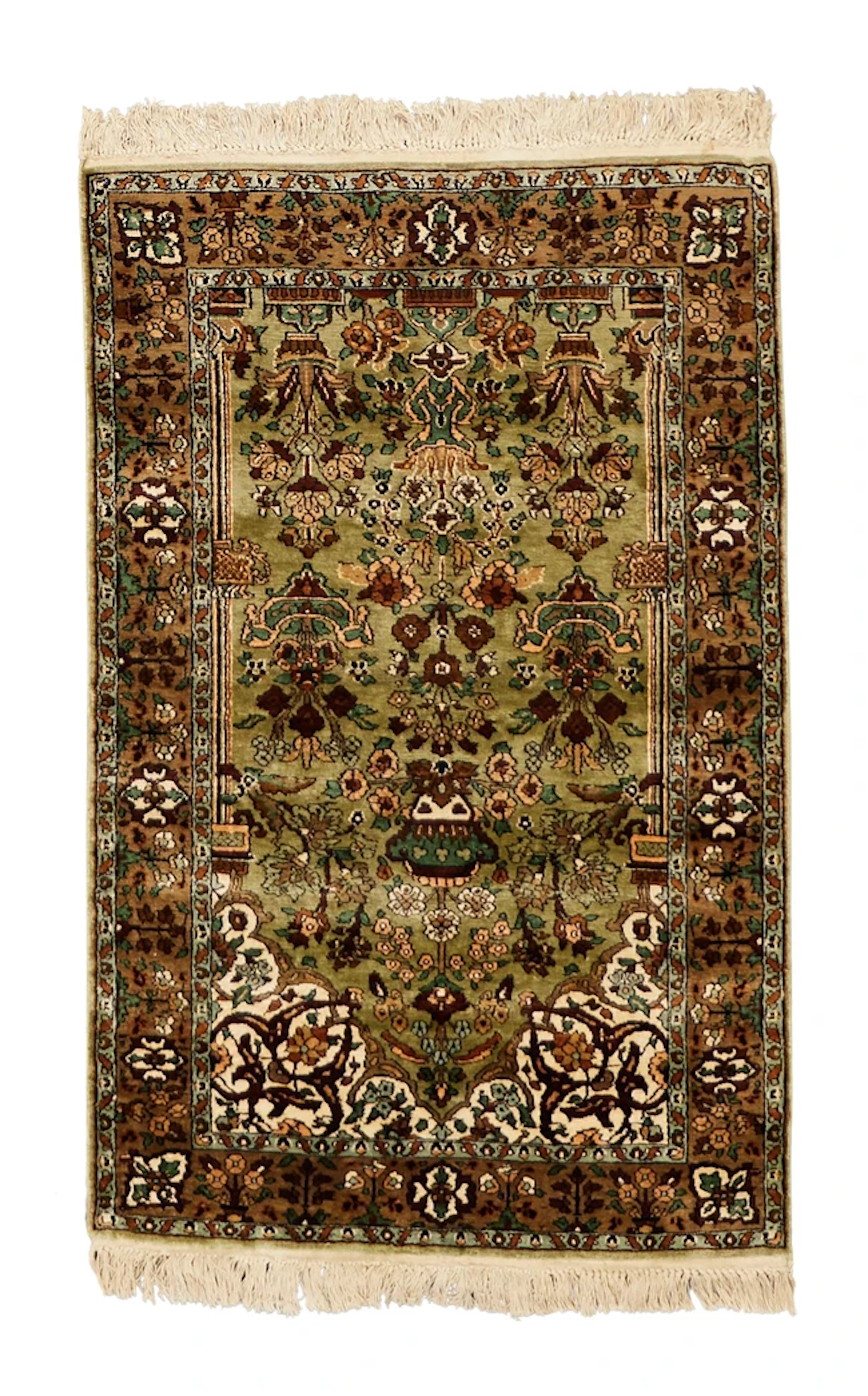 A Persian silk Kashan rug
