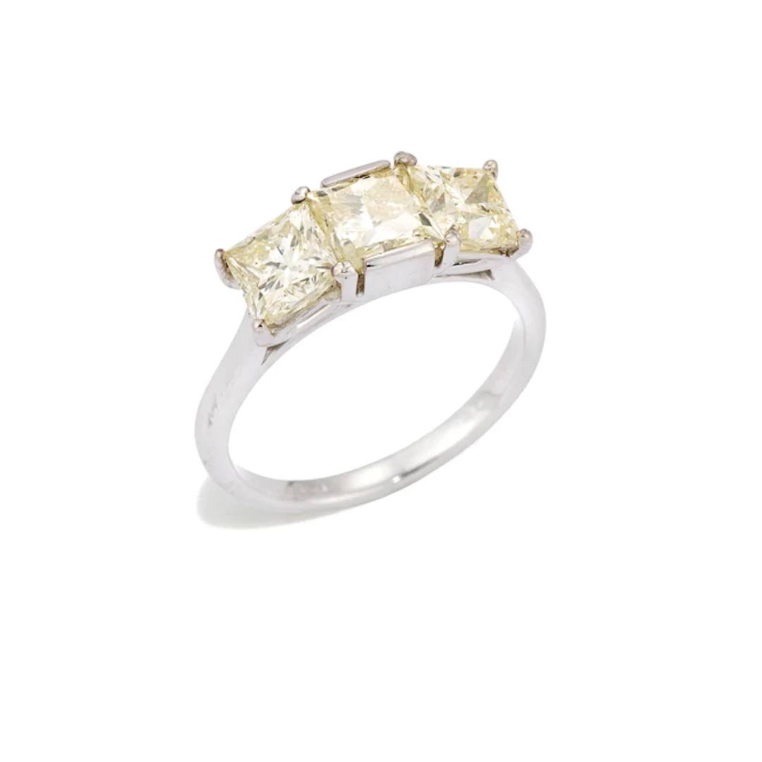 An 18ct white gold diamond three stone ring