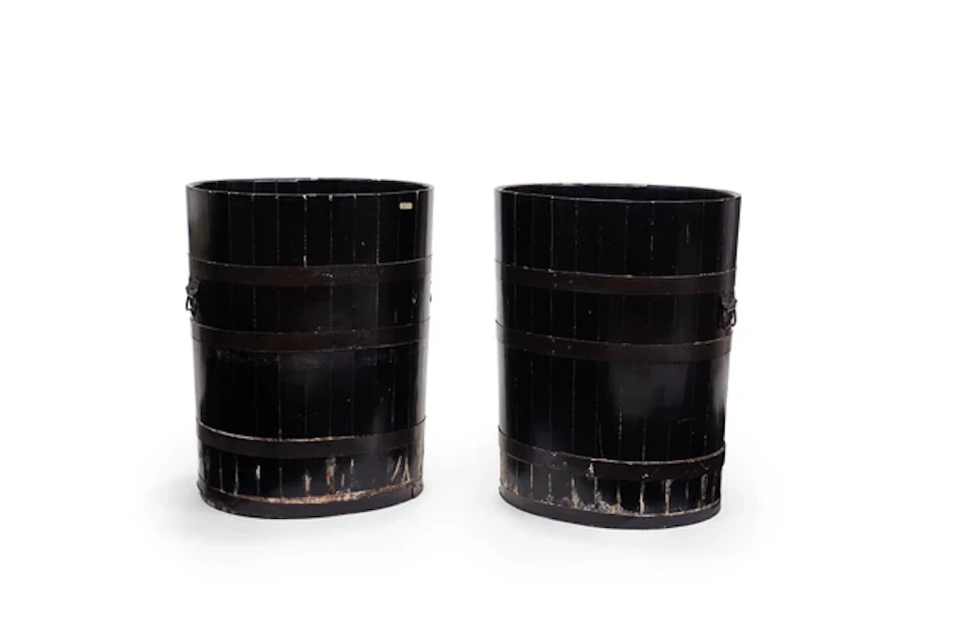 A pair of Japanese black lacquered barrels Taisho period Each of oval form