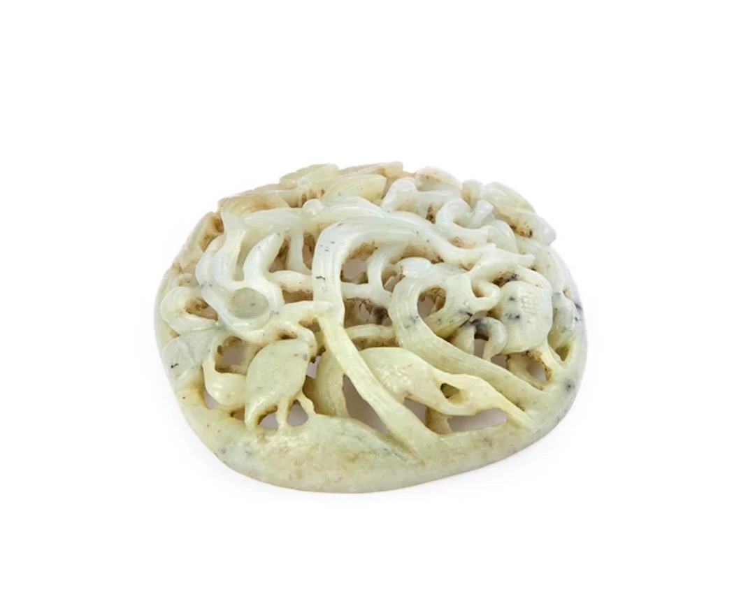 A Chinese green jade openwork plaque Republic period...