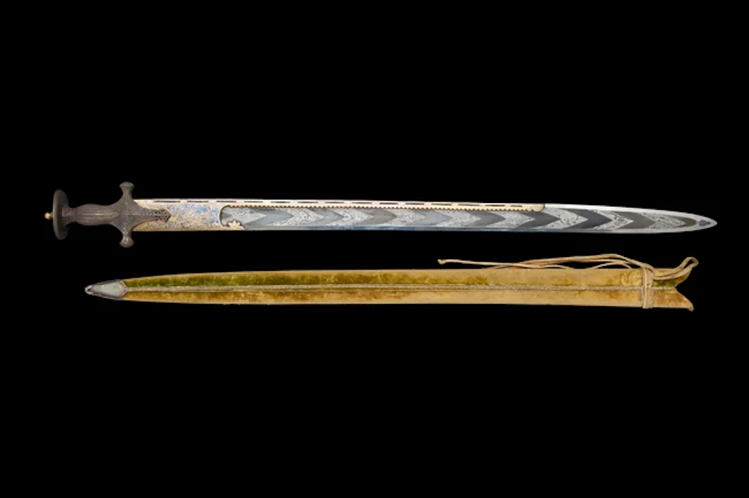 An inscribed gold inlaid sword