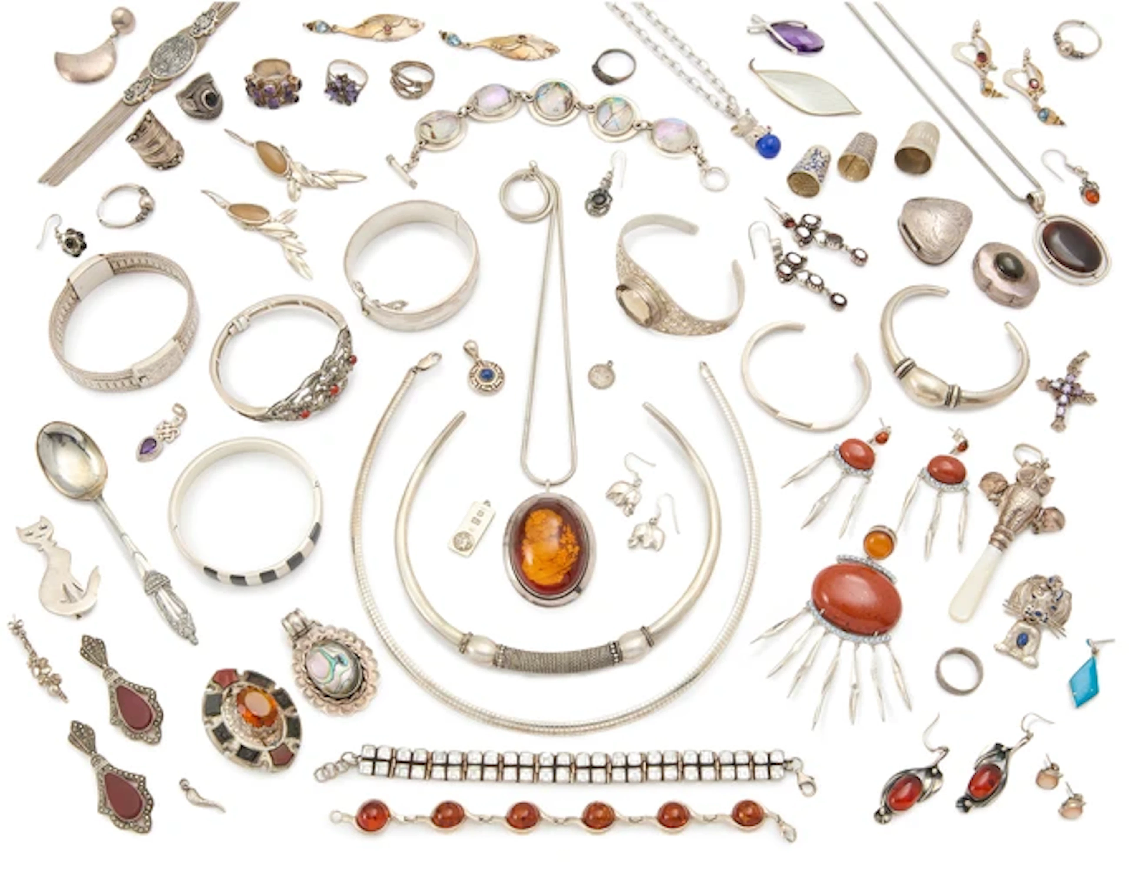 A large group of silver and costume jewellery