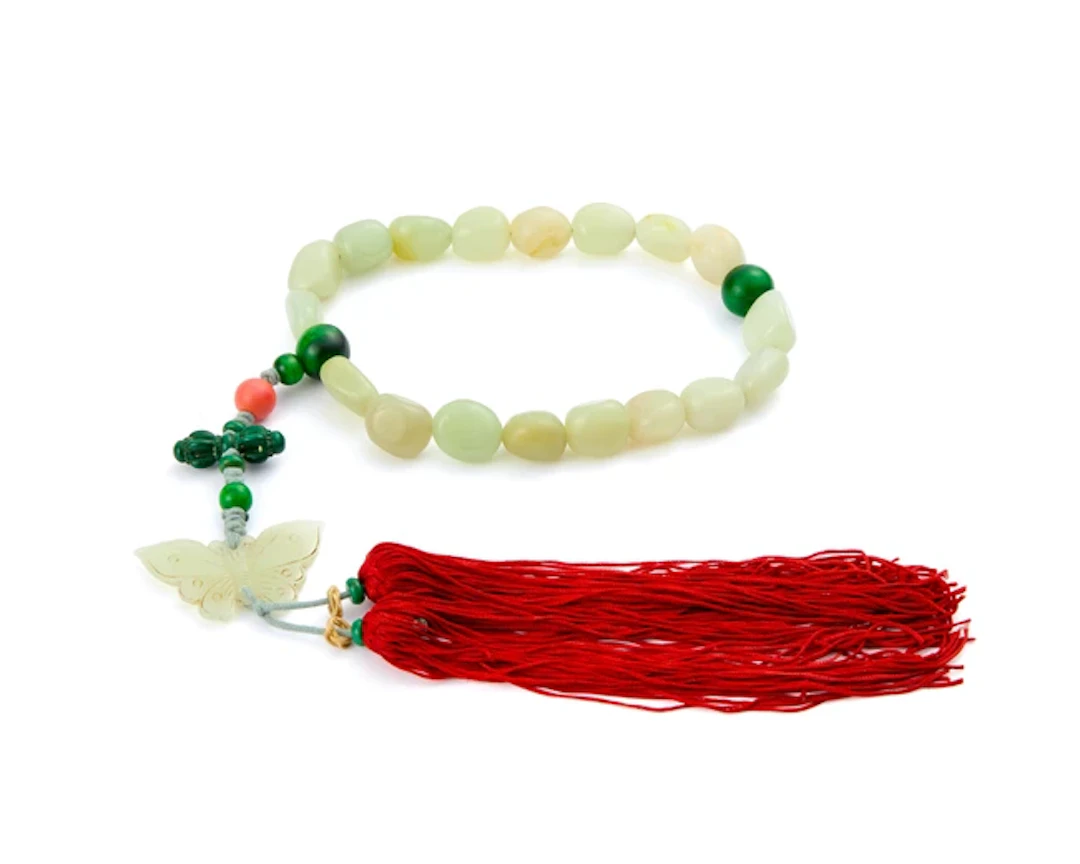 A Chinese jade and malachite beaded rosary Late Qing...