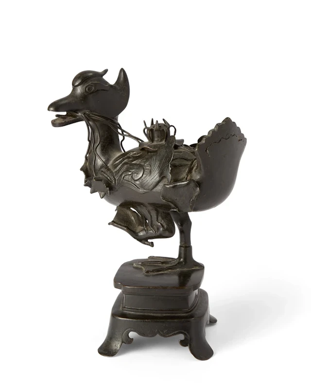A Chinese bronze 'mandarin duck' incense burner and cover...