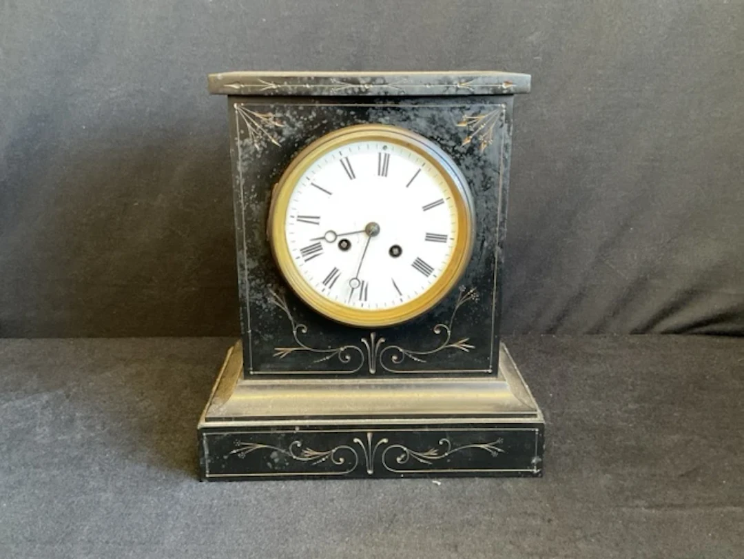A Victorian slate mantel clock with incised gilt aesthetic style foliate