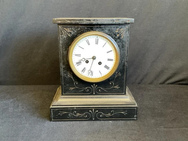 A Victorian slate mantel clock with incised gilt aesthetic style foliate
