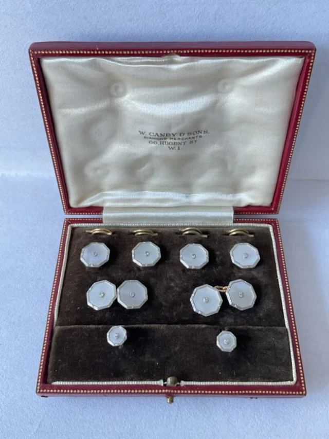 An art deco 9ct gold & platinum gents cufflinks and stud set in original