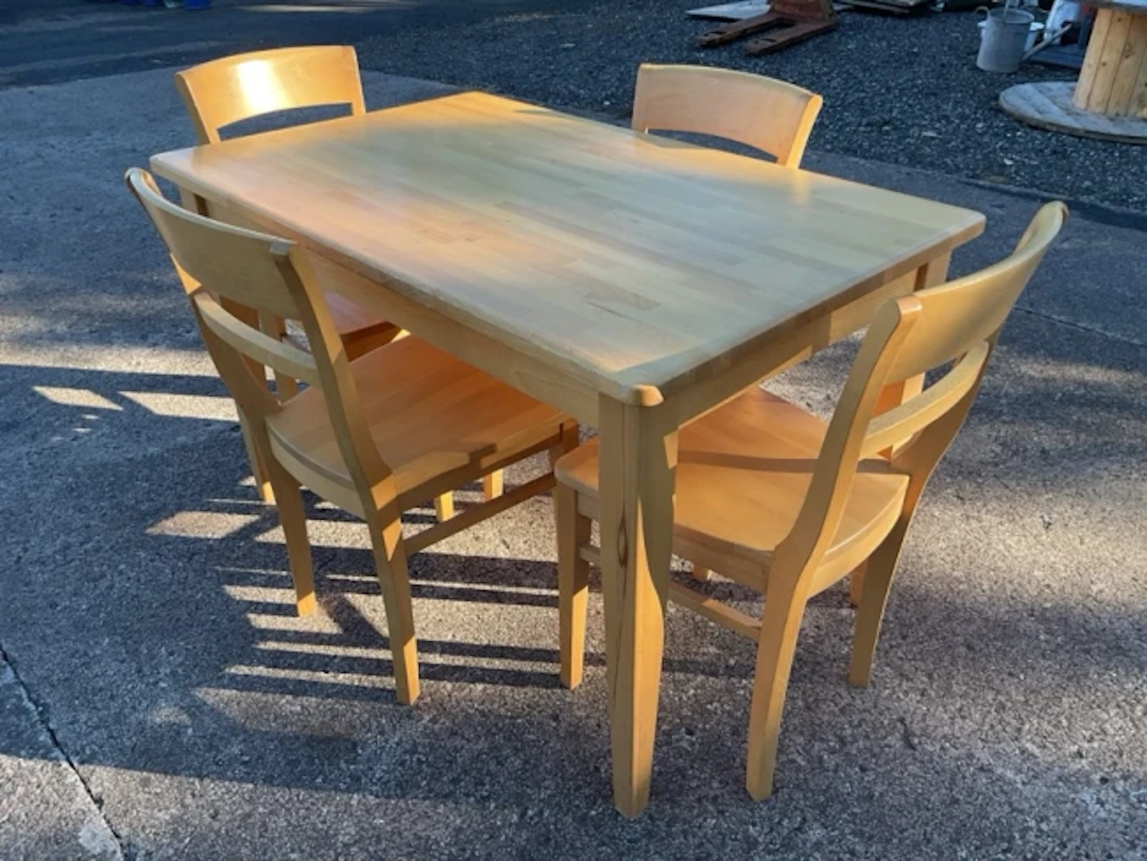 A contemporary beech kitchen table & chair set, the four chairs with