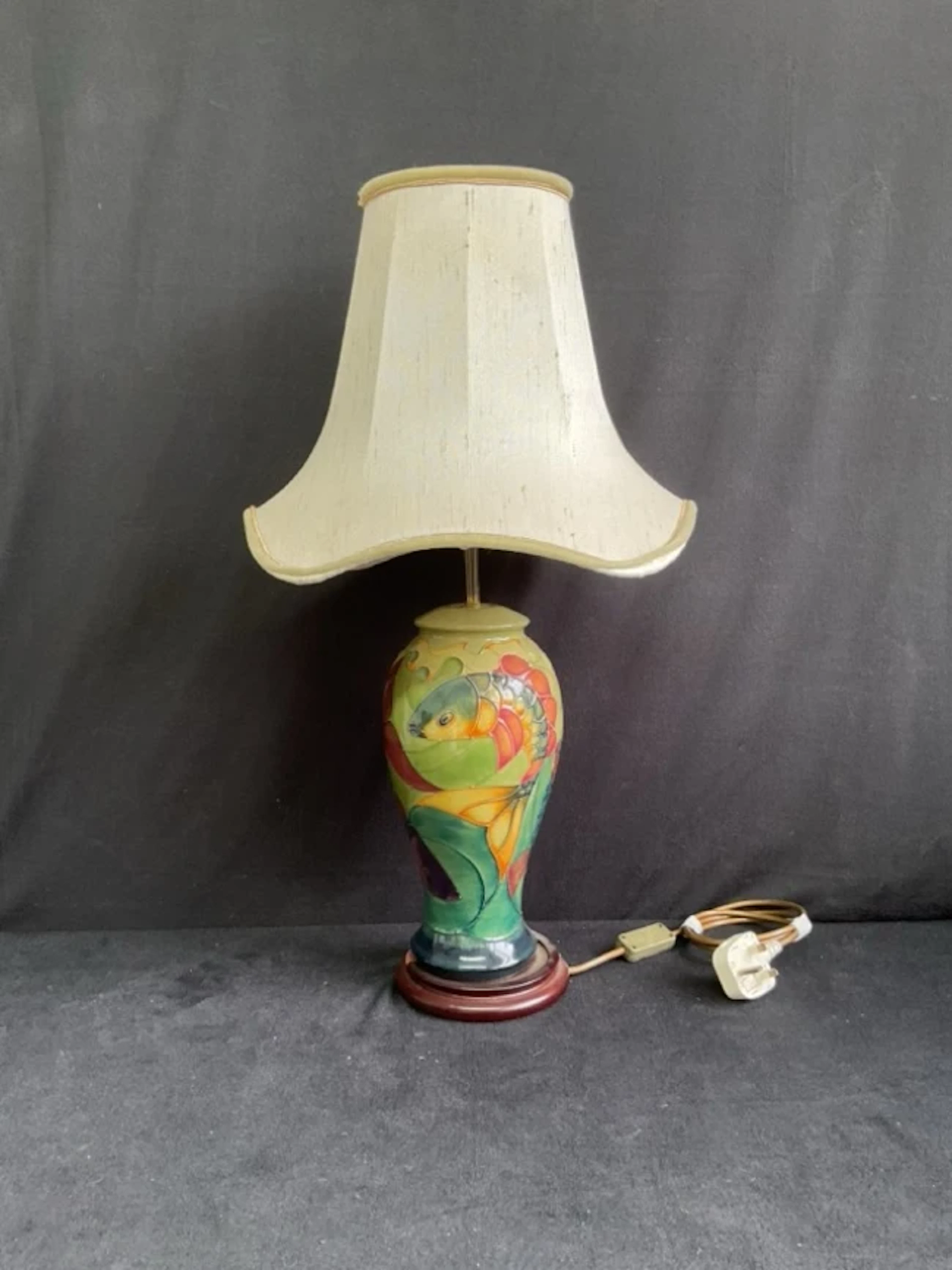 A Moorcroft ceramic baluster tablelamp with tubelined decoration in