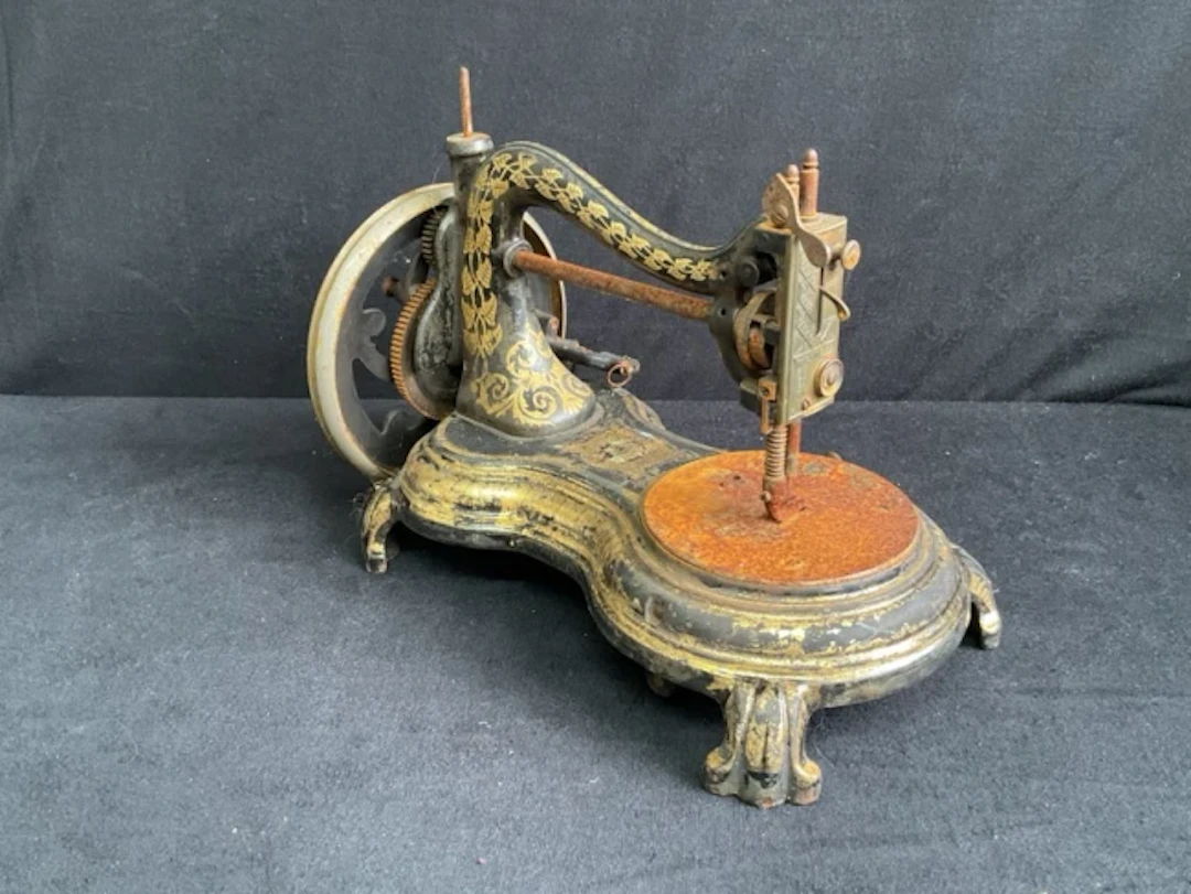 A Victorian Jones Serpentine Swan-Neck cast iron hand cranked sewing