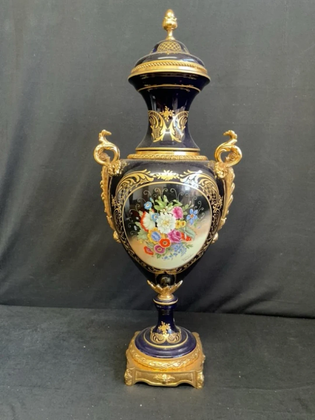 An ormolu mounted Sèvres style bleu mazarin porcelain vase with domed