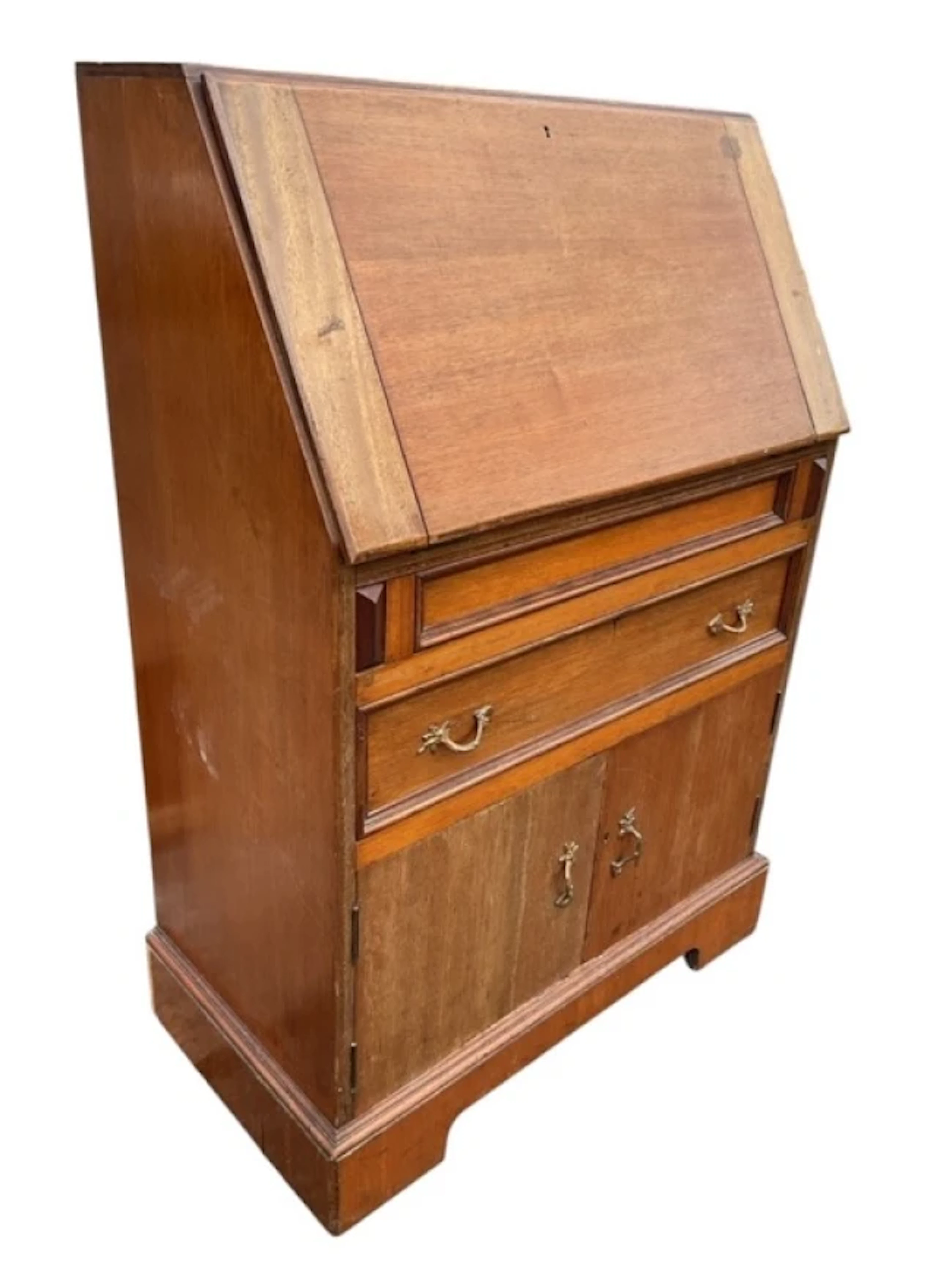 A mahogany bureau with sloped cleated fallfront enclosing pigeonholes