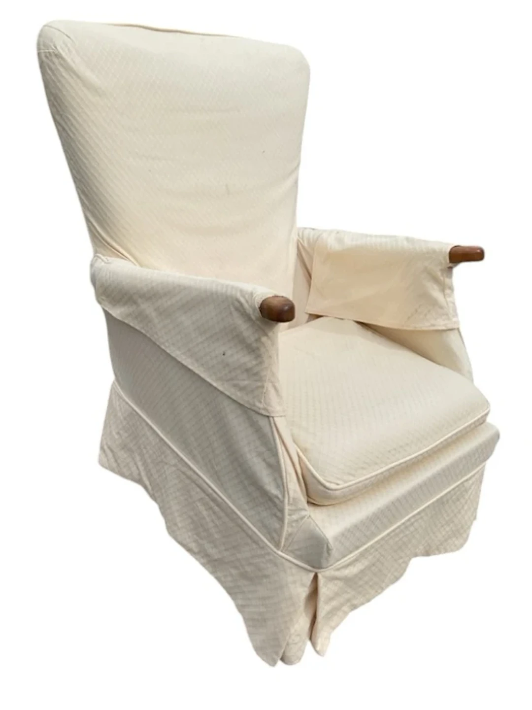 An Edwardian armchair with loose cushion & covers, having flared back