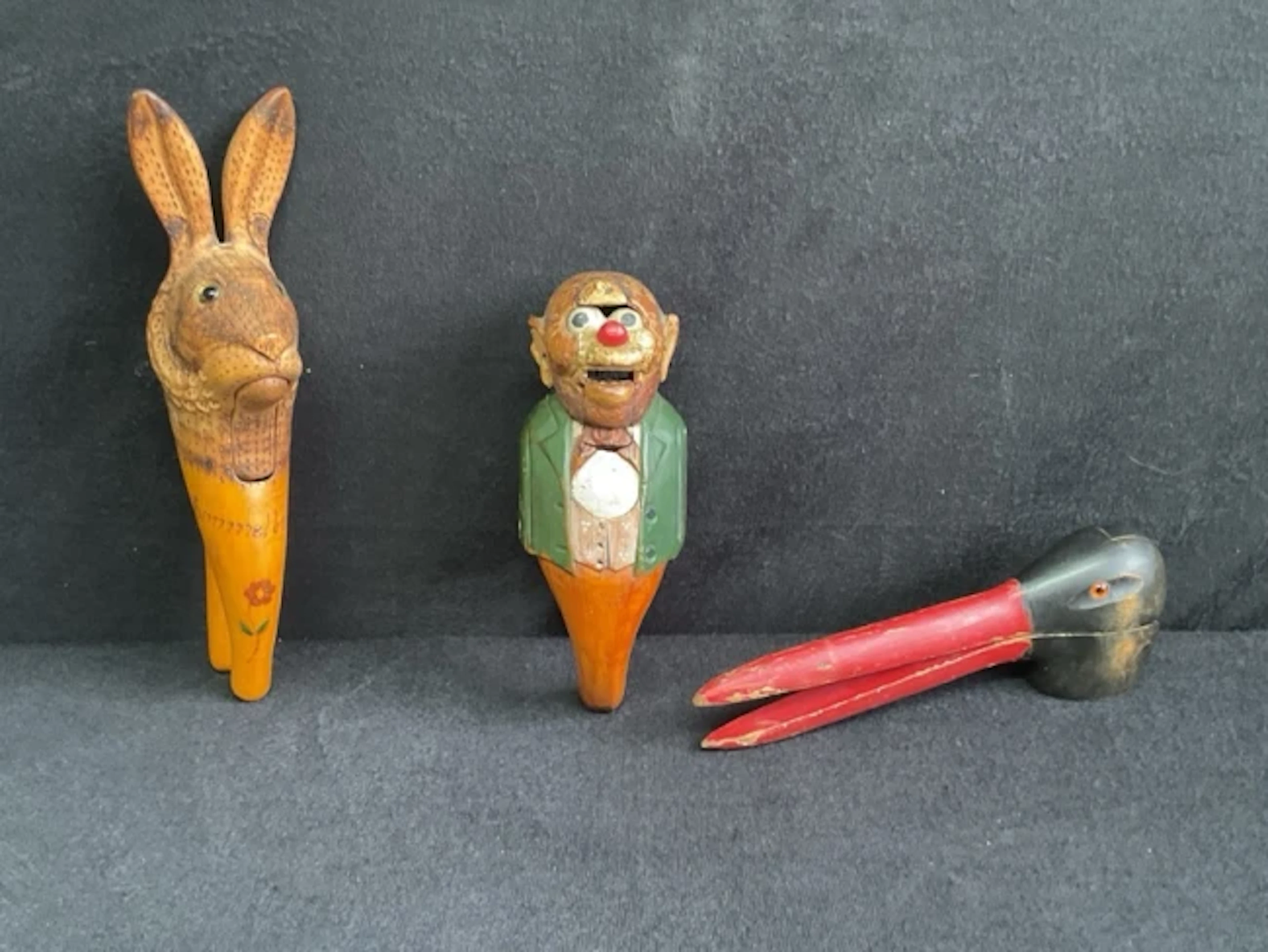 Three continental carved and painted hardwood novelty nutcrackers