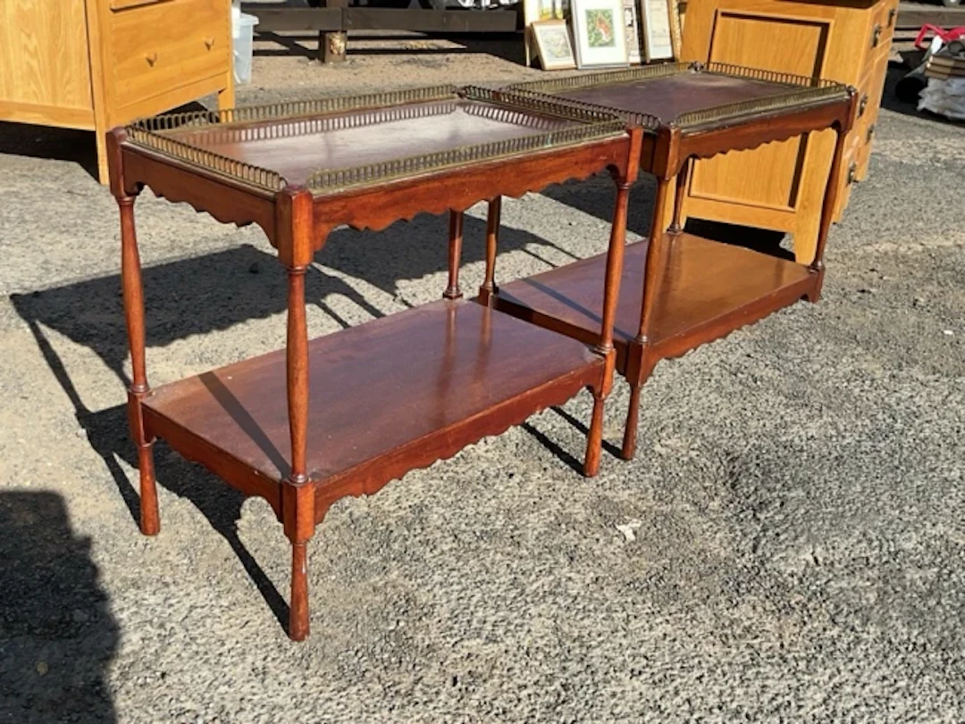 A pair of rectangular mahogany occasional tables with brass galleries