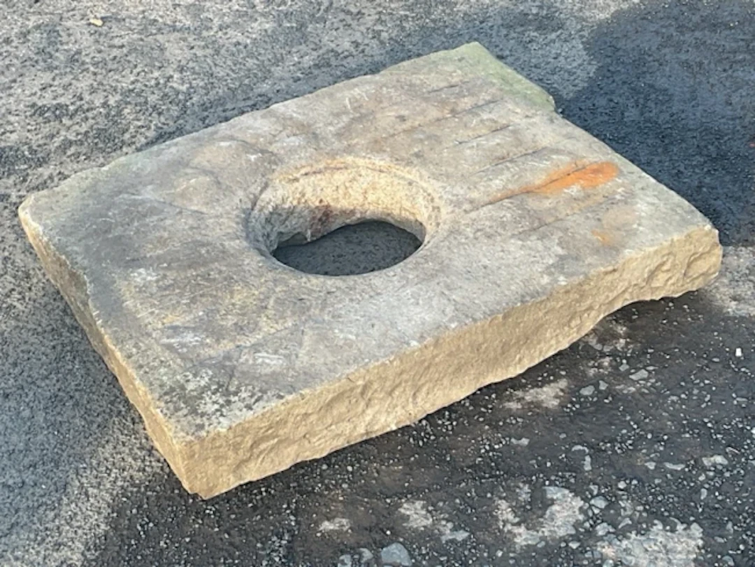 A rectangular C19th sandstone drainer with grooved panel around a