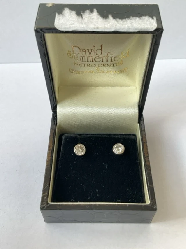 A pair of 18ct white gold diamond stud earrings, the brilliant cut