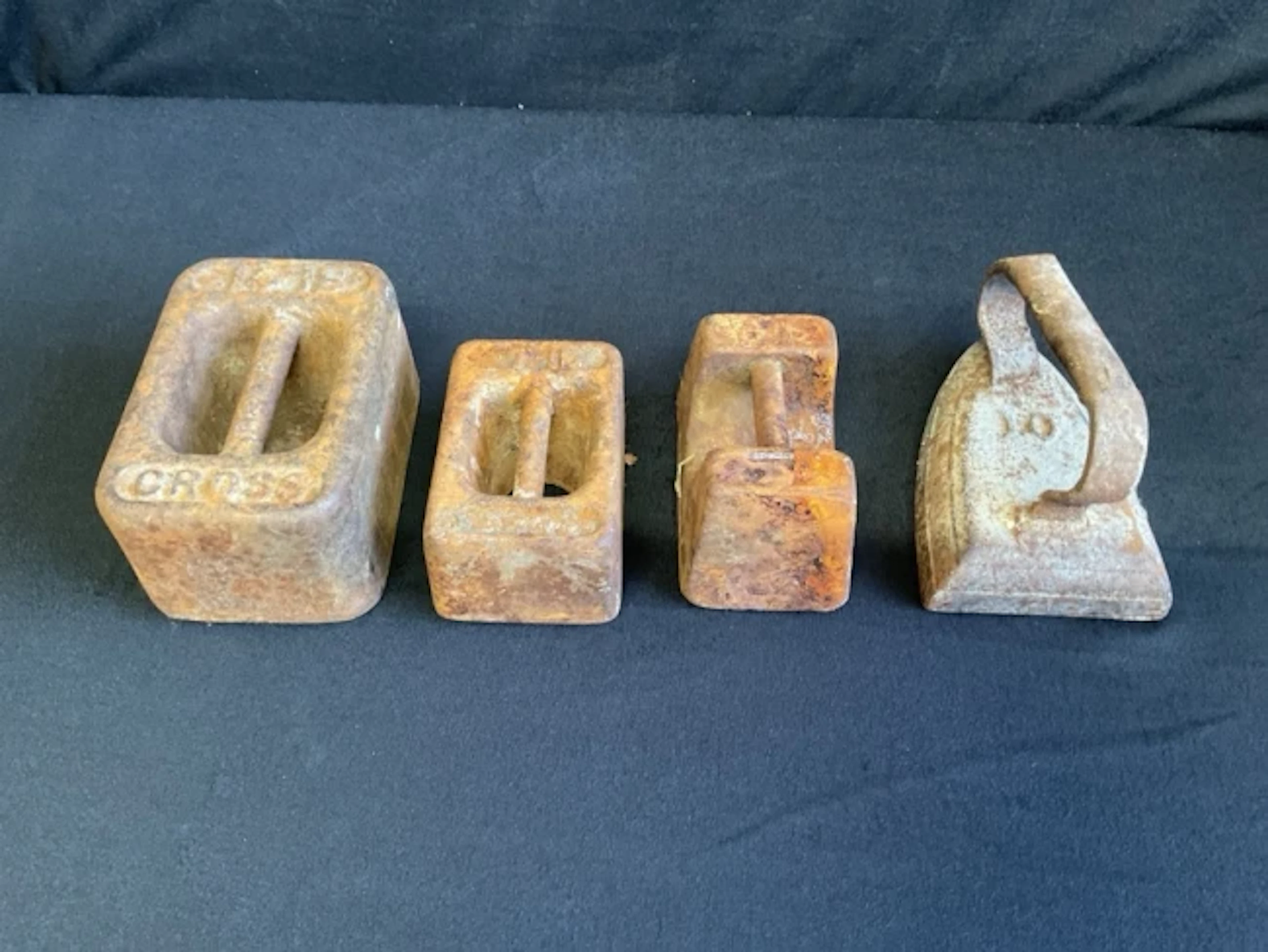A 14lb, and two 7lb cast iron rectangular block weights; and a Victorian