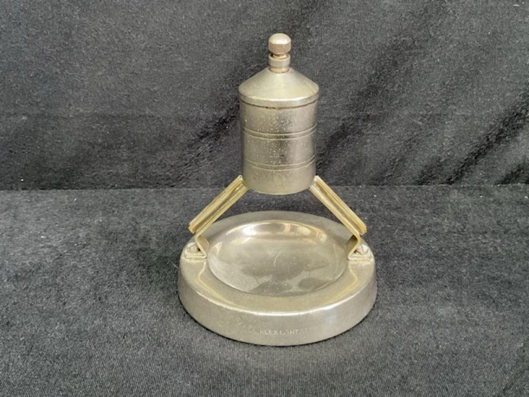 A 1926 deco Muhlex chromed water tower striker-lighter with removable