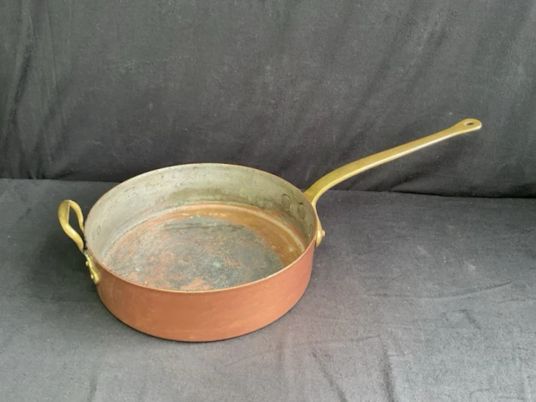 A large 14in heavy gauge circular French copper sauté pan with riveted