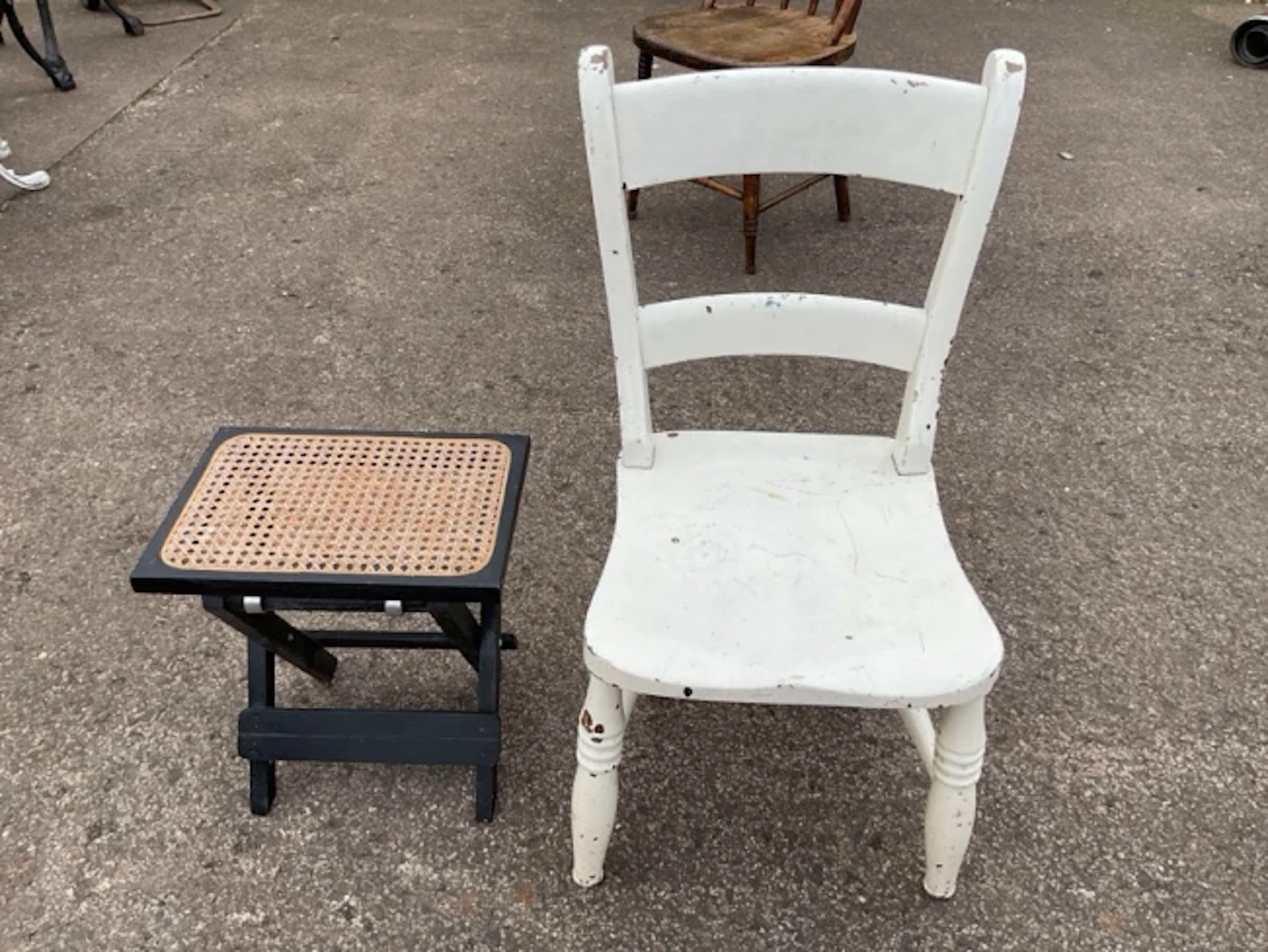 A painted Victorian kitchen chair with curved rails above a solid