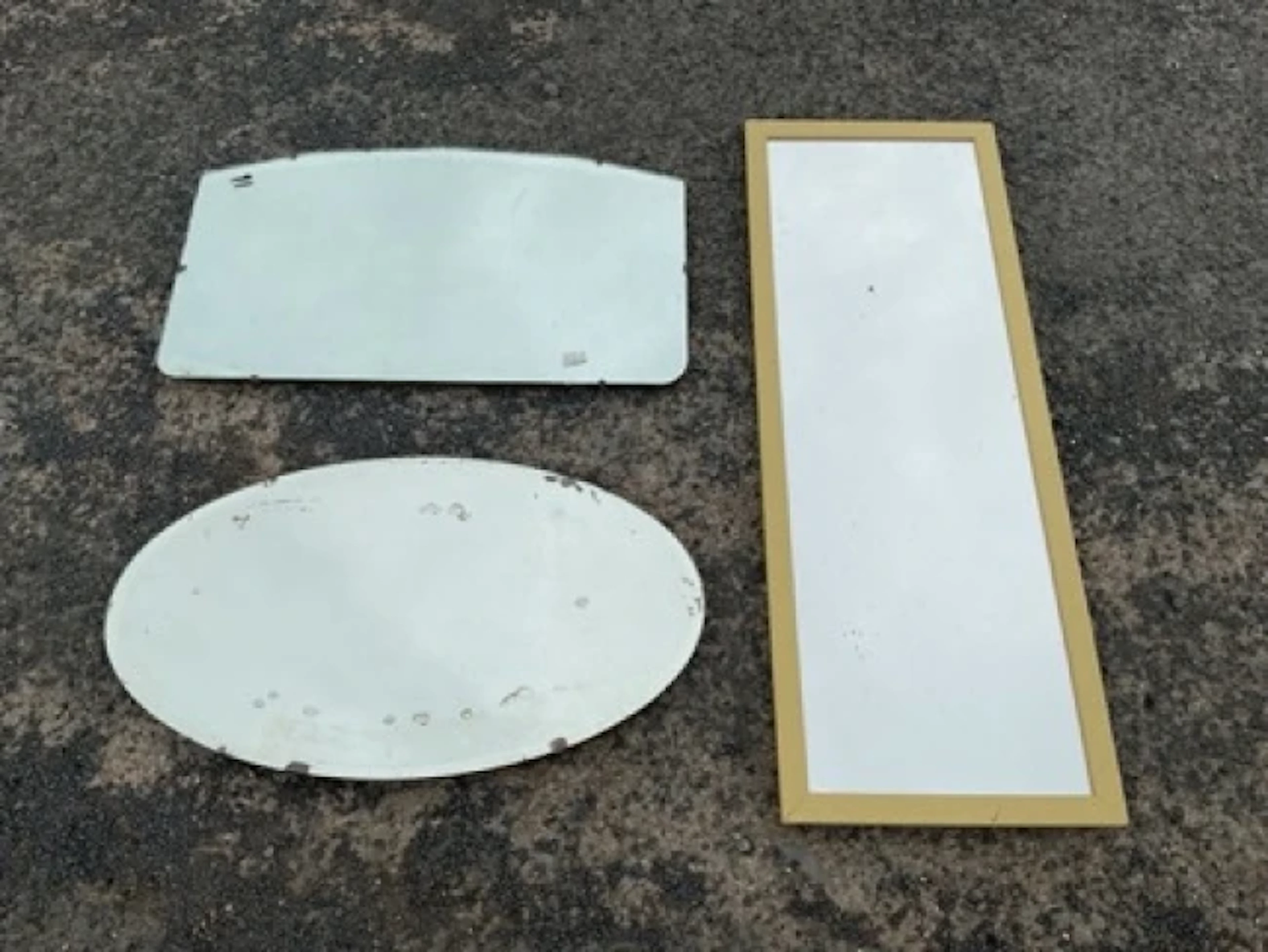 Three mirrors - oval with bevelled plate, rectangular with arched