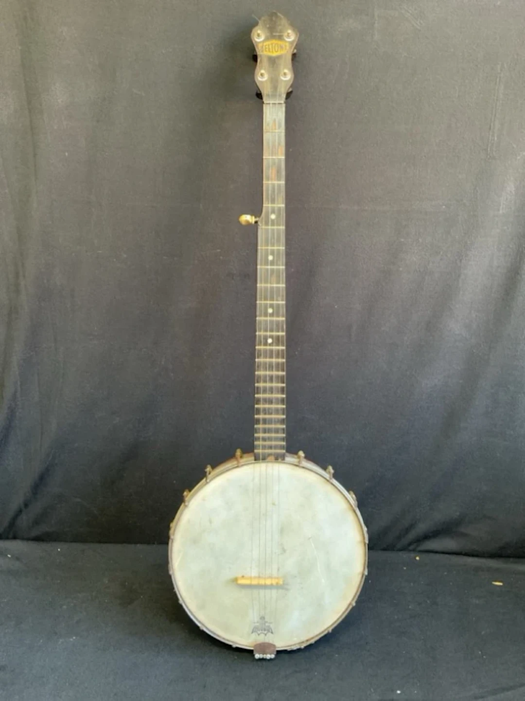 A 30s Beltone open back five-string banjo with chrome mounts and American