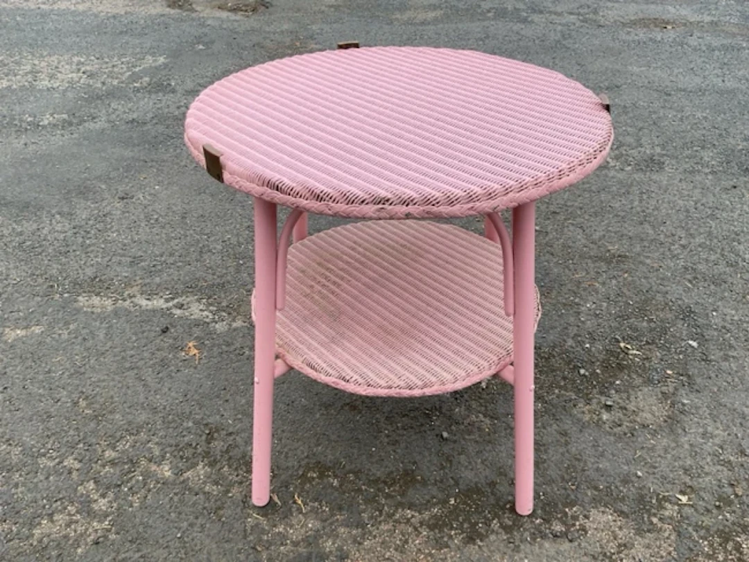 A painted circular cane coffee table, formerly having glass top, raised