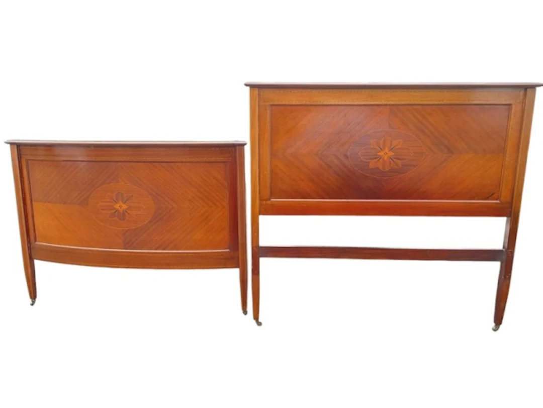 An Edwardian chequer strung mahogany double bed with moulded rails