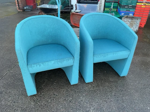 A pair of 1970s Italian designer chairs with tapering tub backs above