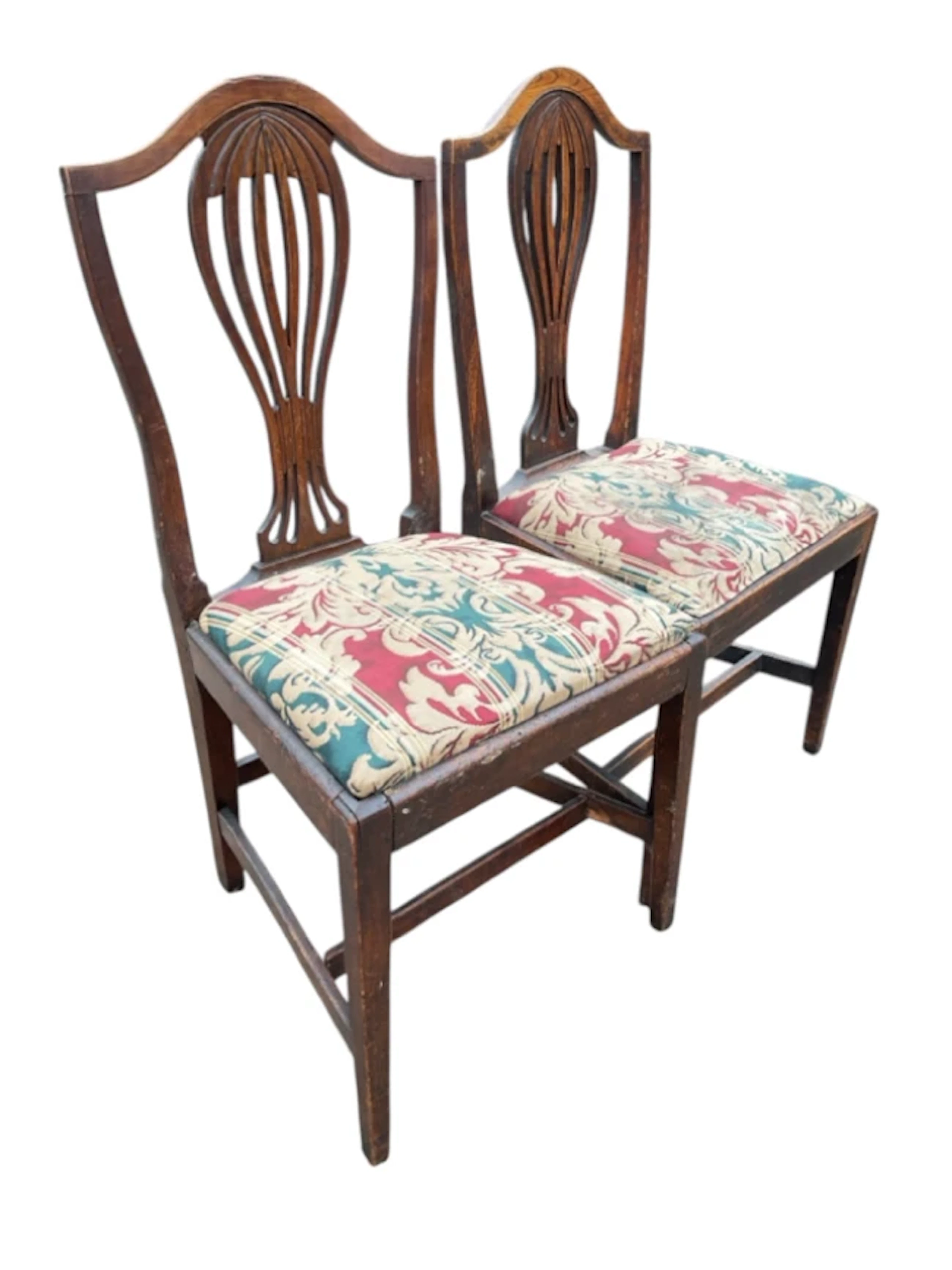 A pair of Georgian elm Hepplewhite style chairs with arched backs
