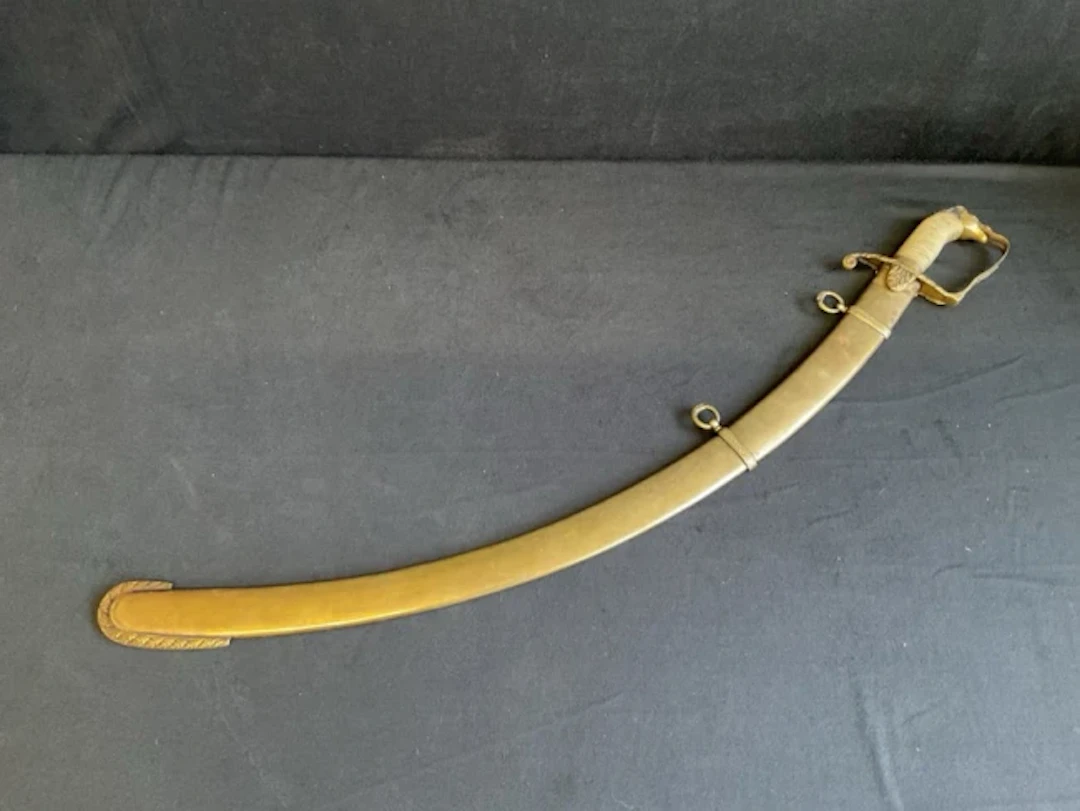 An early C19th officers sabre with brass hilt, horse head pommel