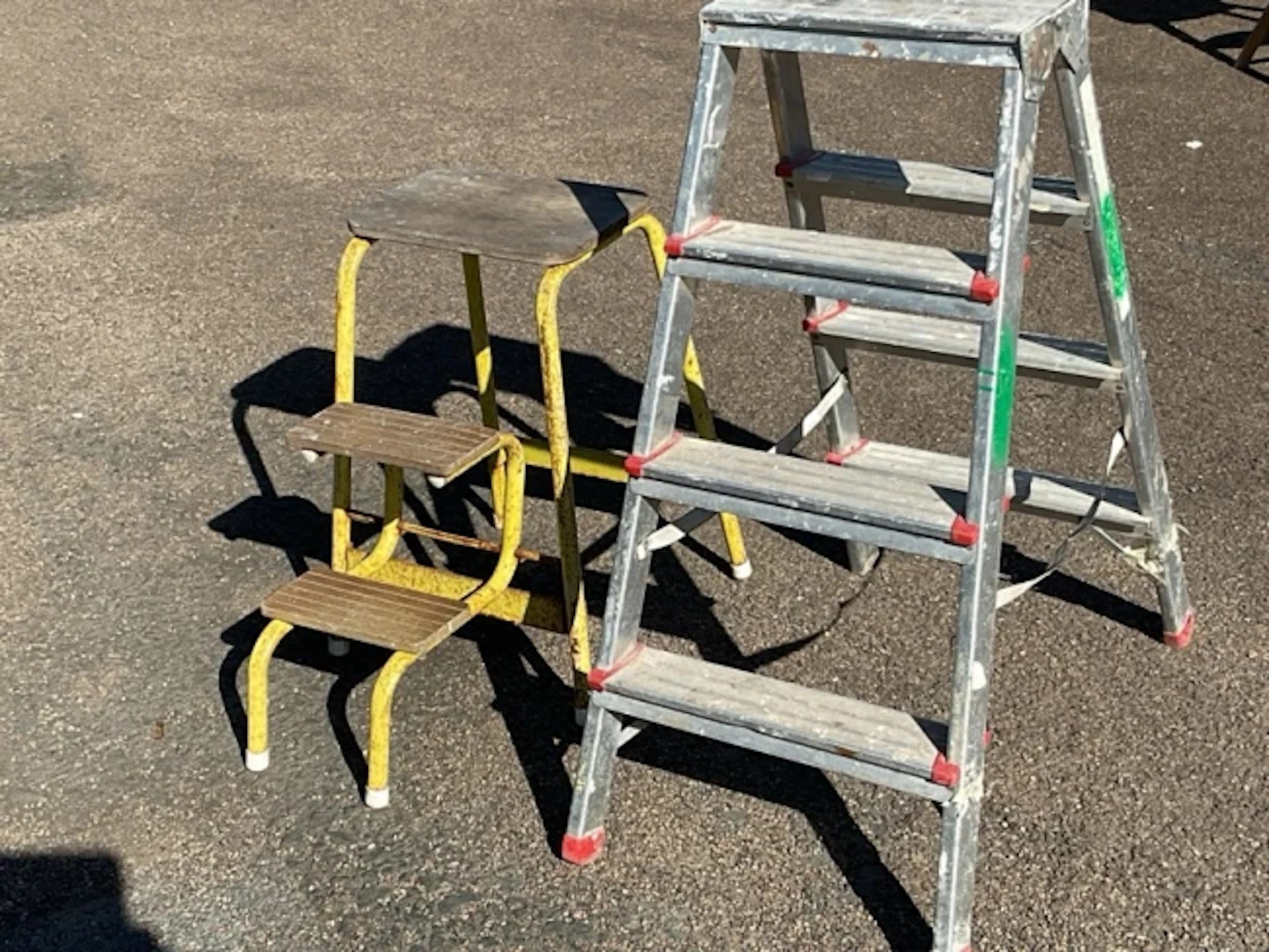 A set of aluminium folding steps with three treads to each side; and