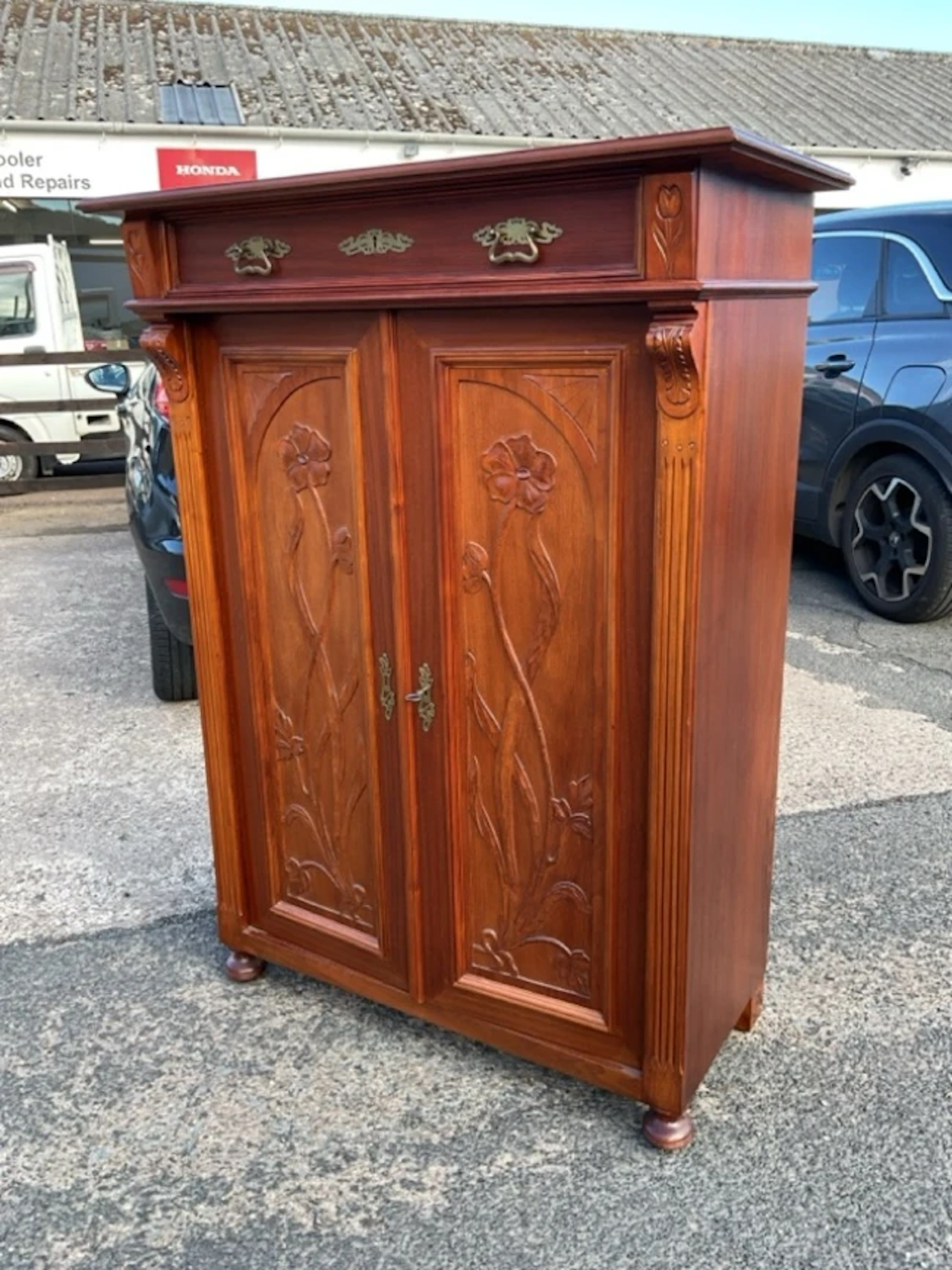 A European art nouveau hardwood cabinet with panelled frieze drawer