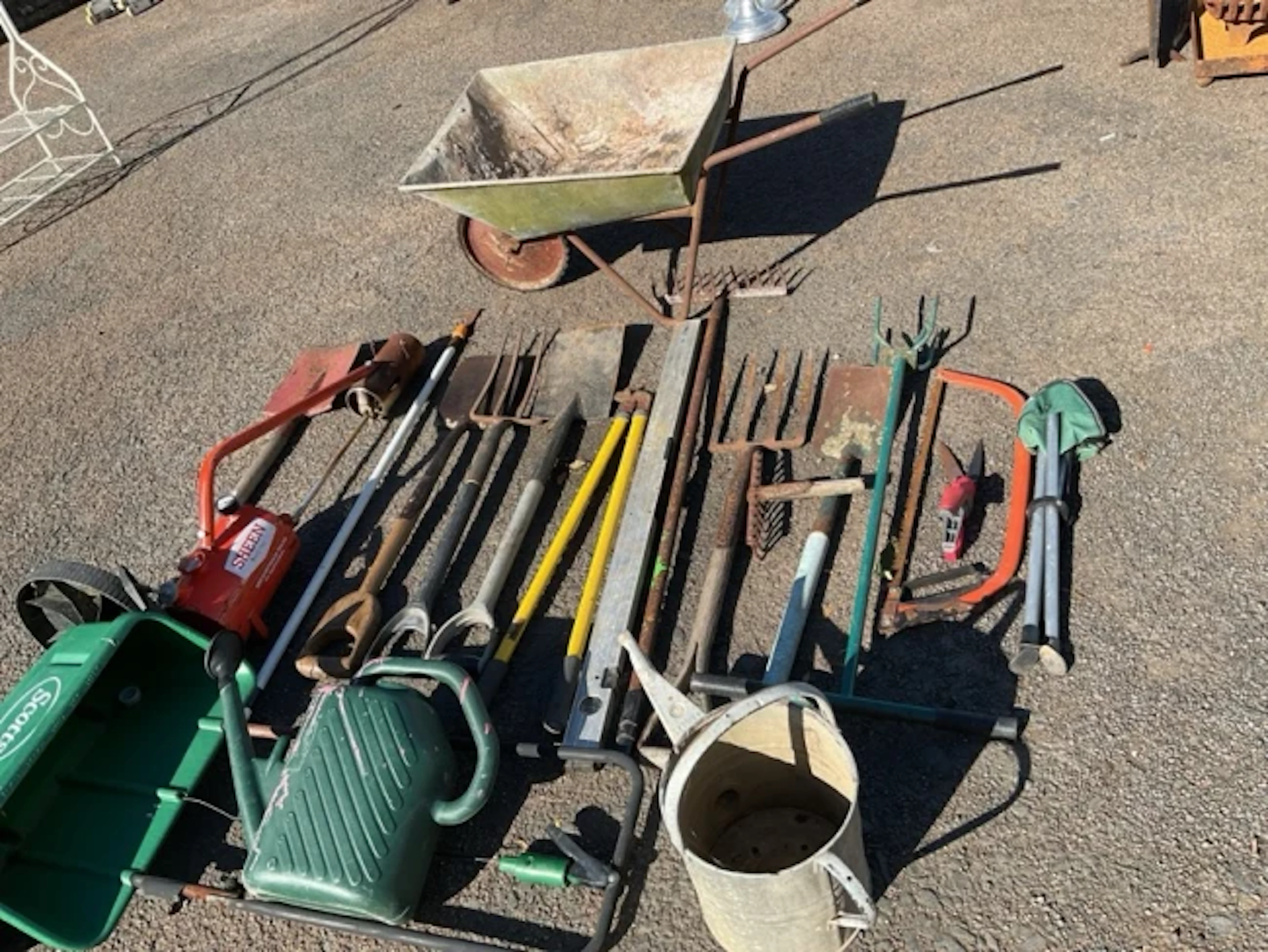 Miscellaneous gardening gear - a wheelbarrow, forks, spades, a galvanised