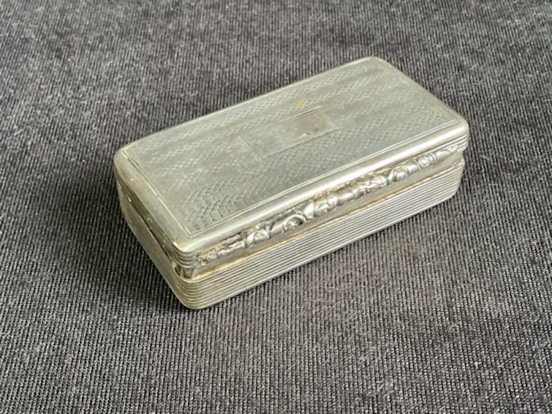 A William IV rectangular hallmarked silver snuffbox, makers mark TS