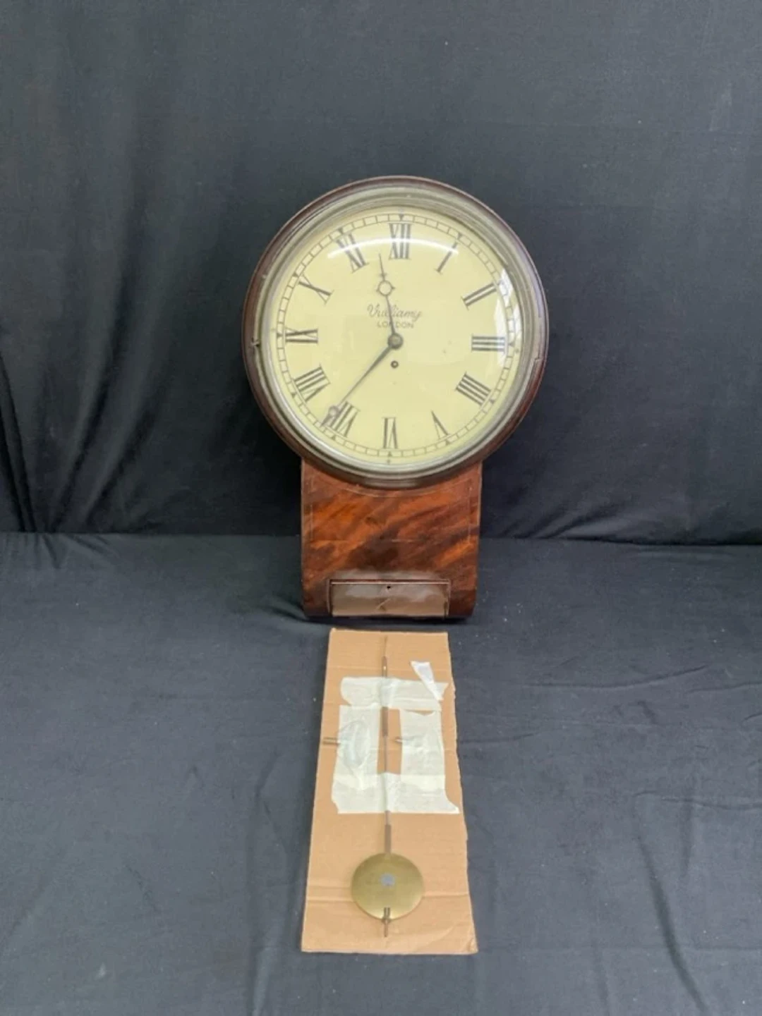 A Victorian mahogany drop-dial wall clock with circular moulded face