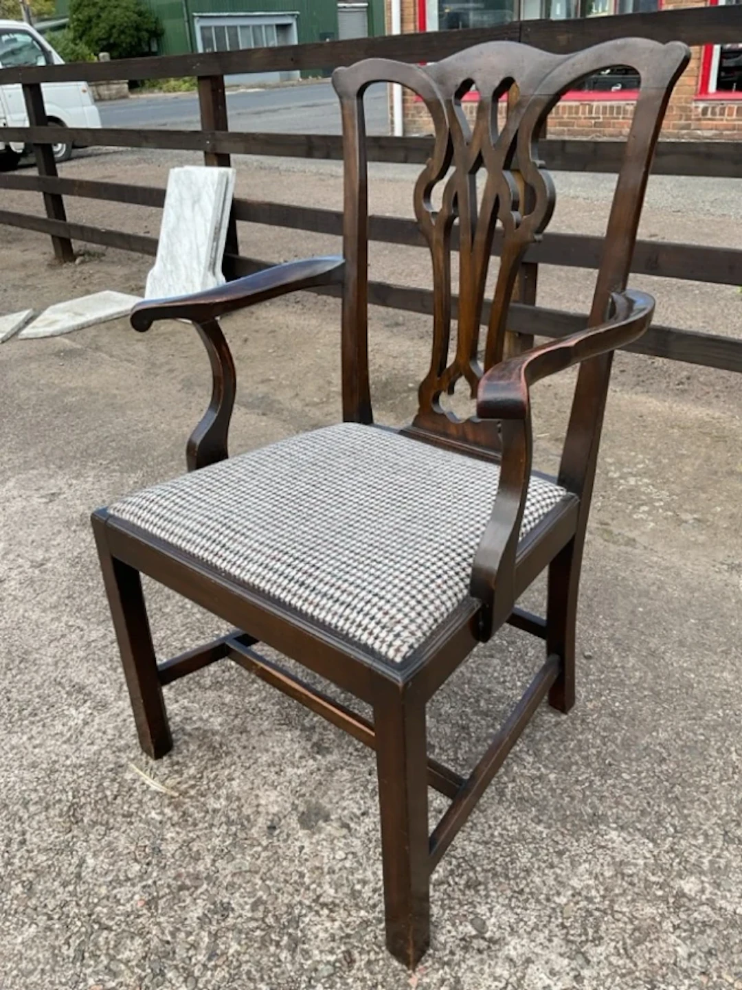 A C19th mahogany Chippendale style armchair with wavy crestrail above
