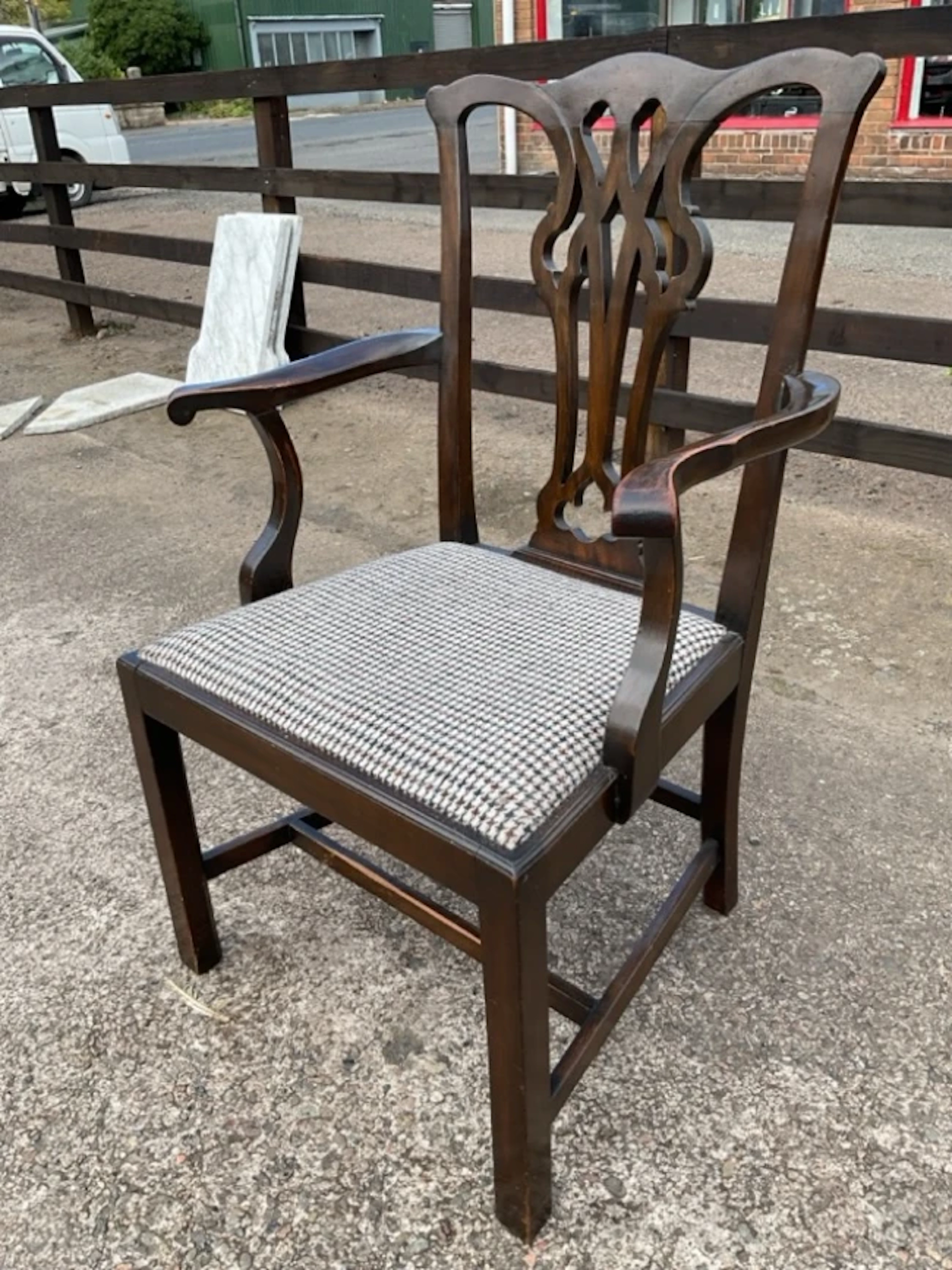 A C19th mahogany Chippendale style armchair with wavy crestrail above